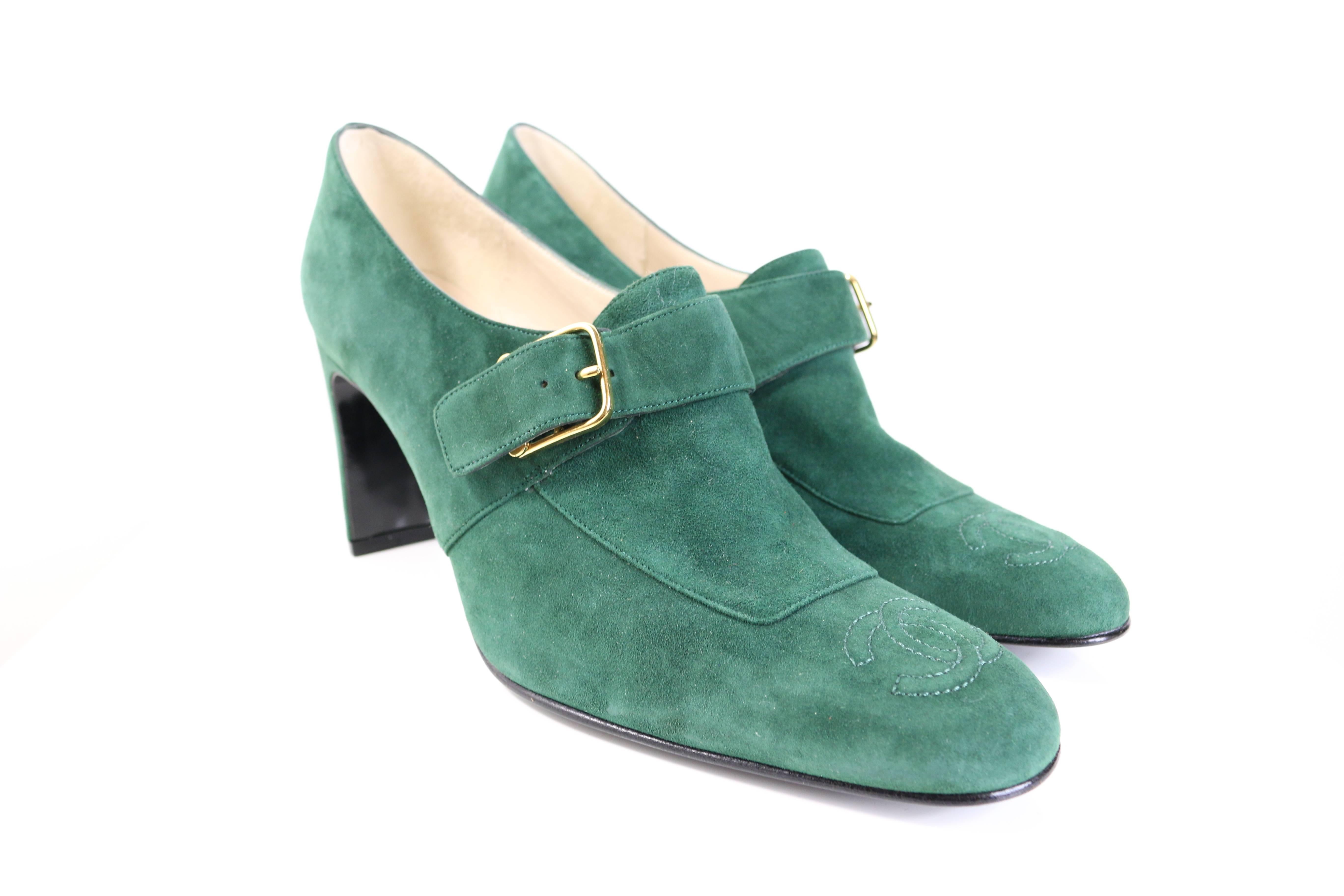 - Timeless and classic 90s Chanel green suede square toe heels with gold hardware ankle strap closing. 

- 