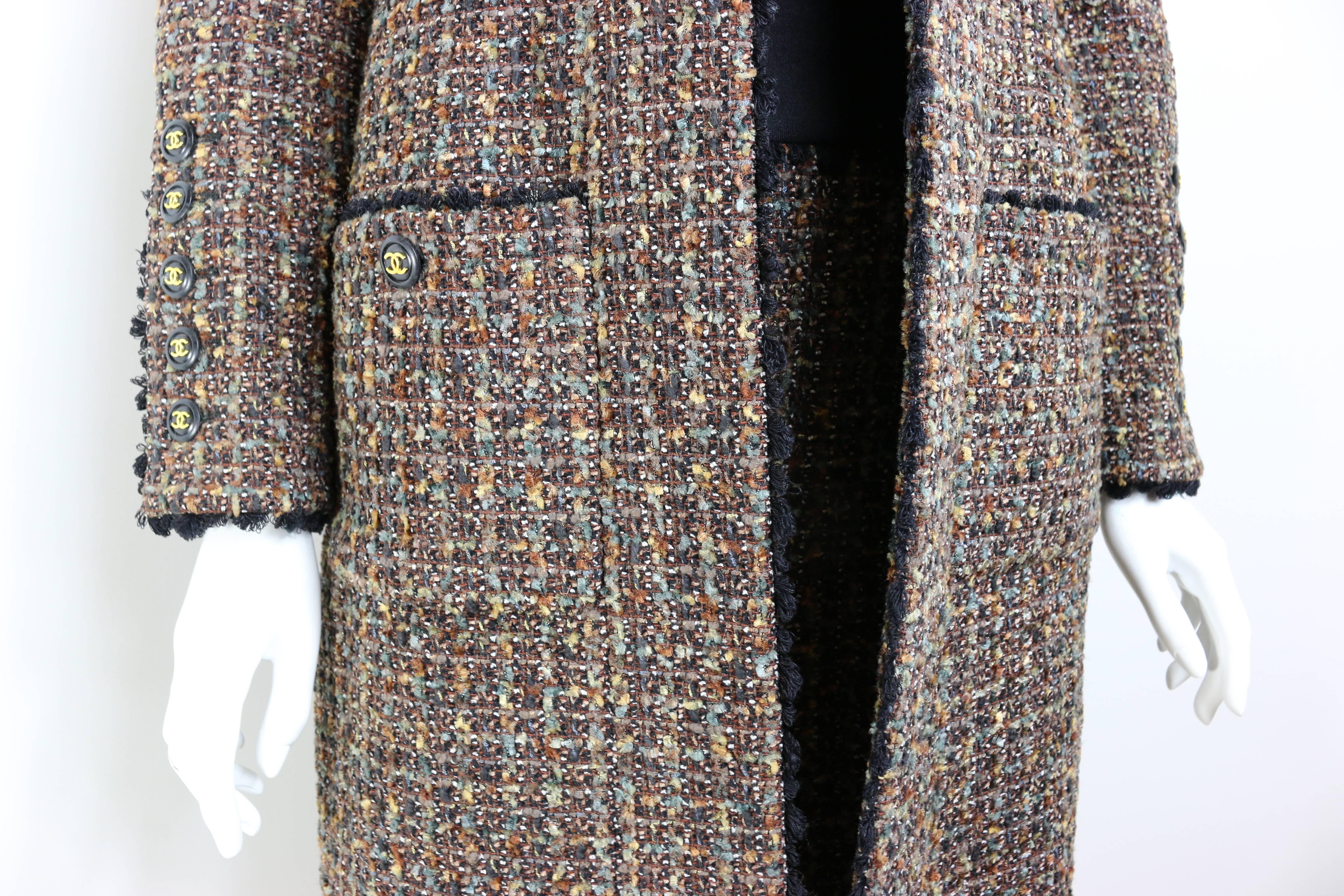 - Vintage Chanel brown/yellow/green/white/black wool tweed long coat and dress from fall 1994 collection. 

- Featuring four front pockets buttons and five buttons on each cuff. 

- Straight lined coat. 

- Black trimming throughout the coat and