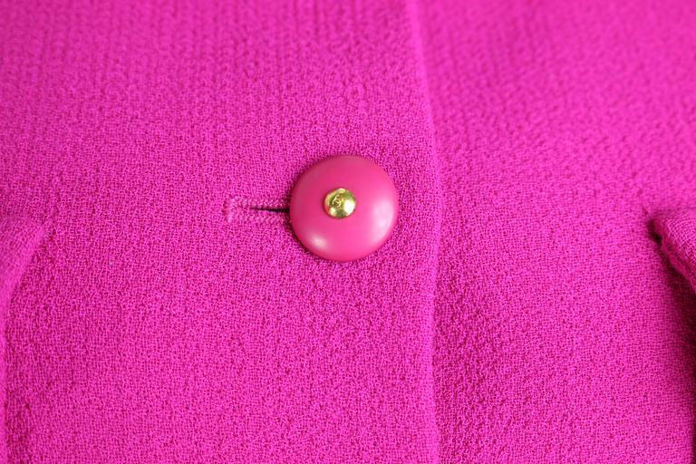 - Vintage Chanel fuchsia boucle wool jacket from Fall 1995 collection. 

- Military style inspired jacket. 

- Peter Pan style collar.  

- The jacket is featuring four front buttons pockets and six front center buttons. 

- Size 40 France.