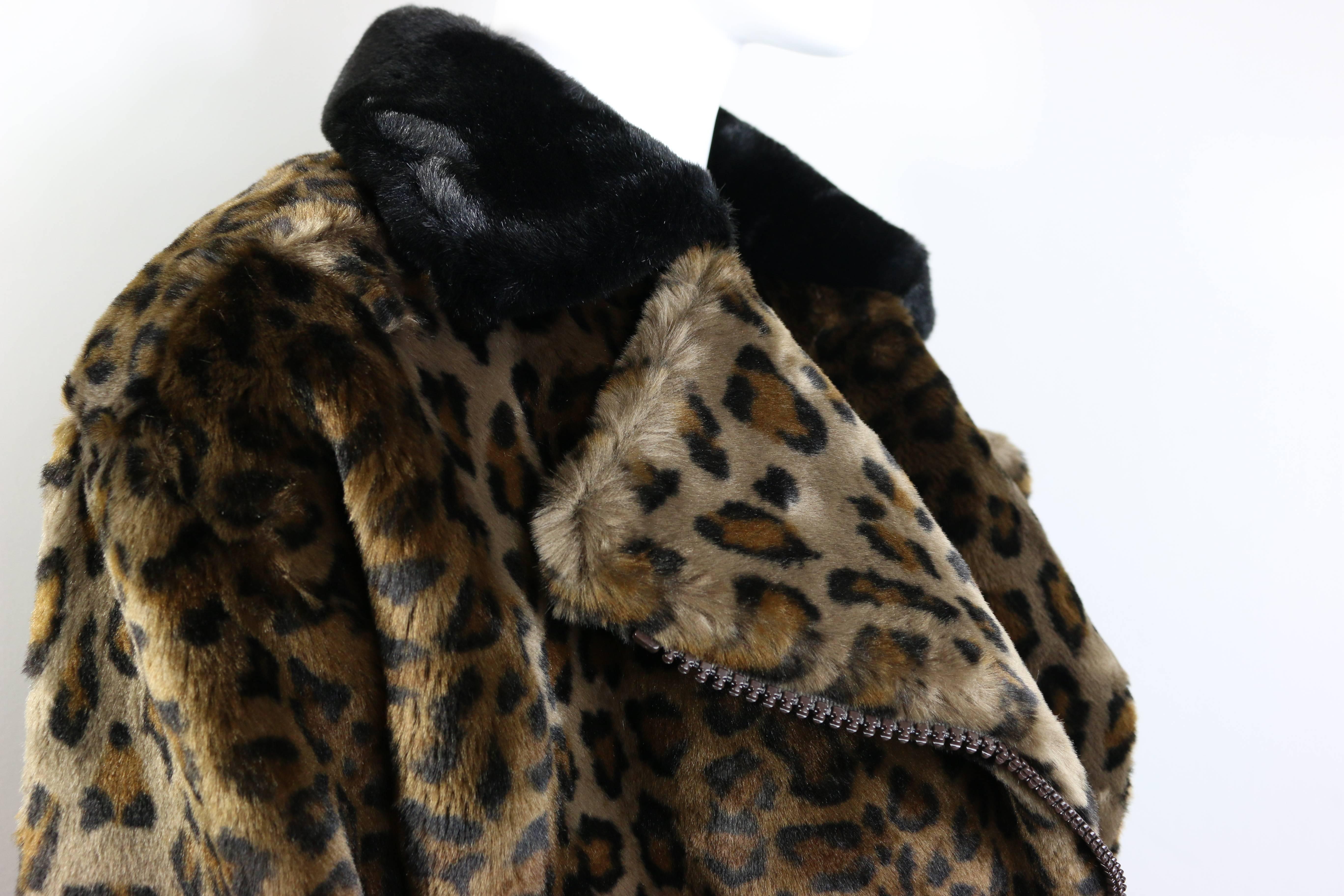 - Vintage 90s Nina Ricci animal leopard-print faux fur coat. 

- Featuring a diagonal zipper on front with black faux fur collar and folder cuffs. 

- 100 % Cotton, Rayon, Acrylic . 

- No size listed but it looks like a size M. 

- Height: