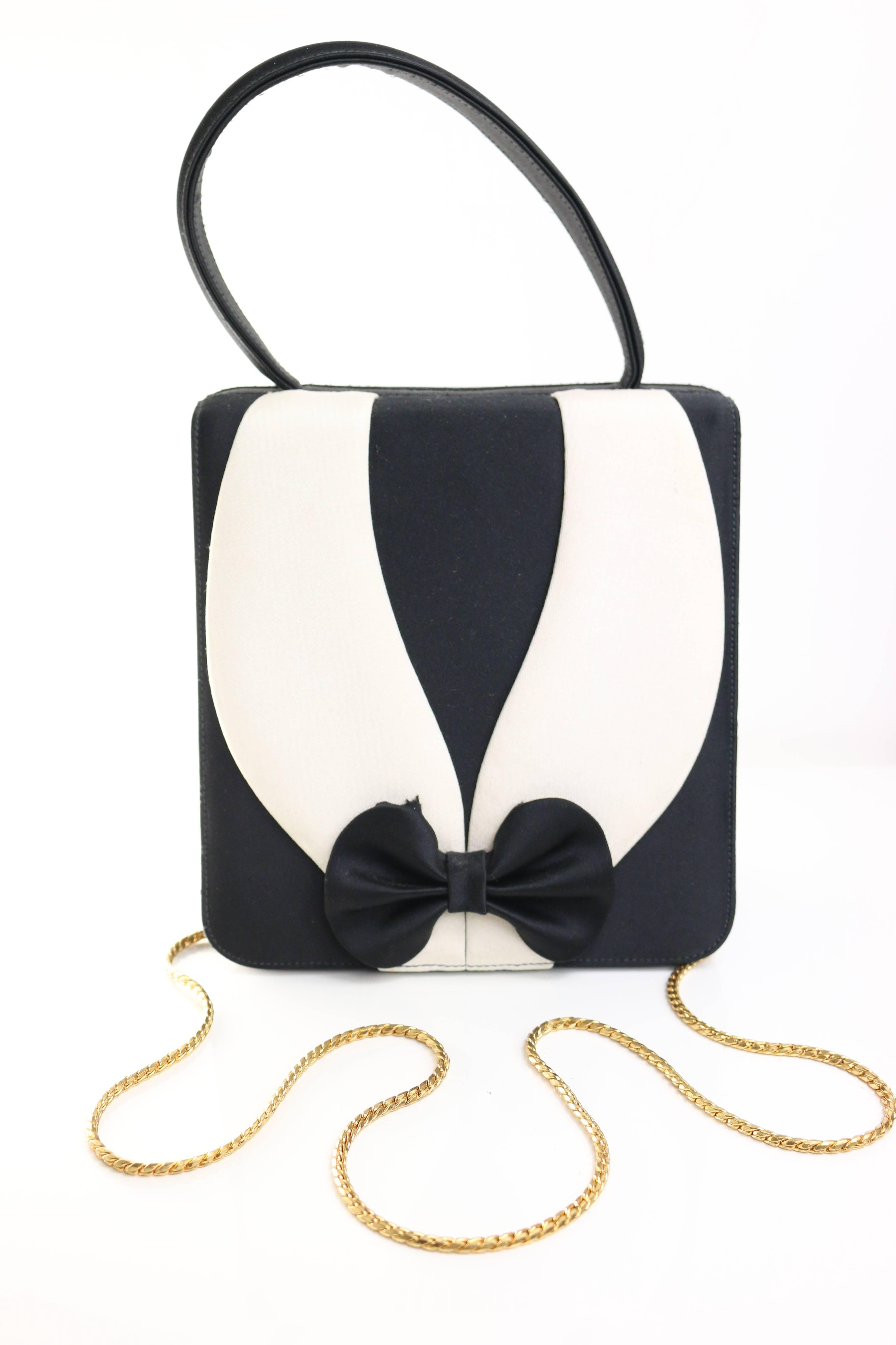 - Vintage 90s Carey Adina satin tuxedo handbag. 

- Measurement: Length: 15cm. Height: 27cm. Width: 6cm. 

- Featuring a 50cm long detachable gold chain.

- Made in USA. 

- Condition: Excellent in preowned condition.  Please note this vintage item