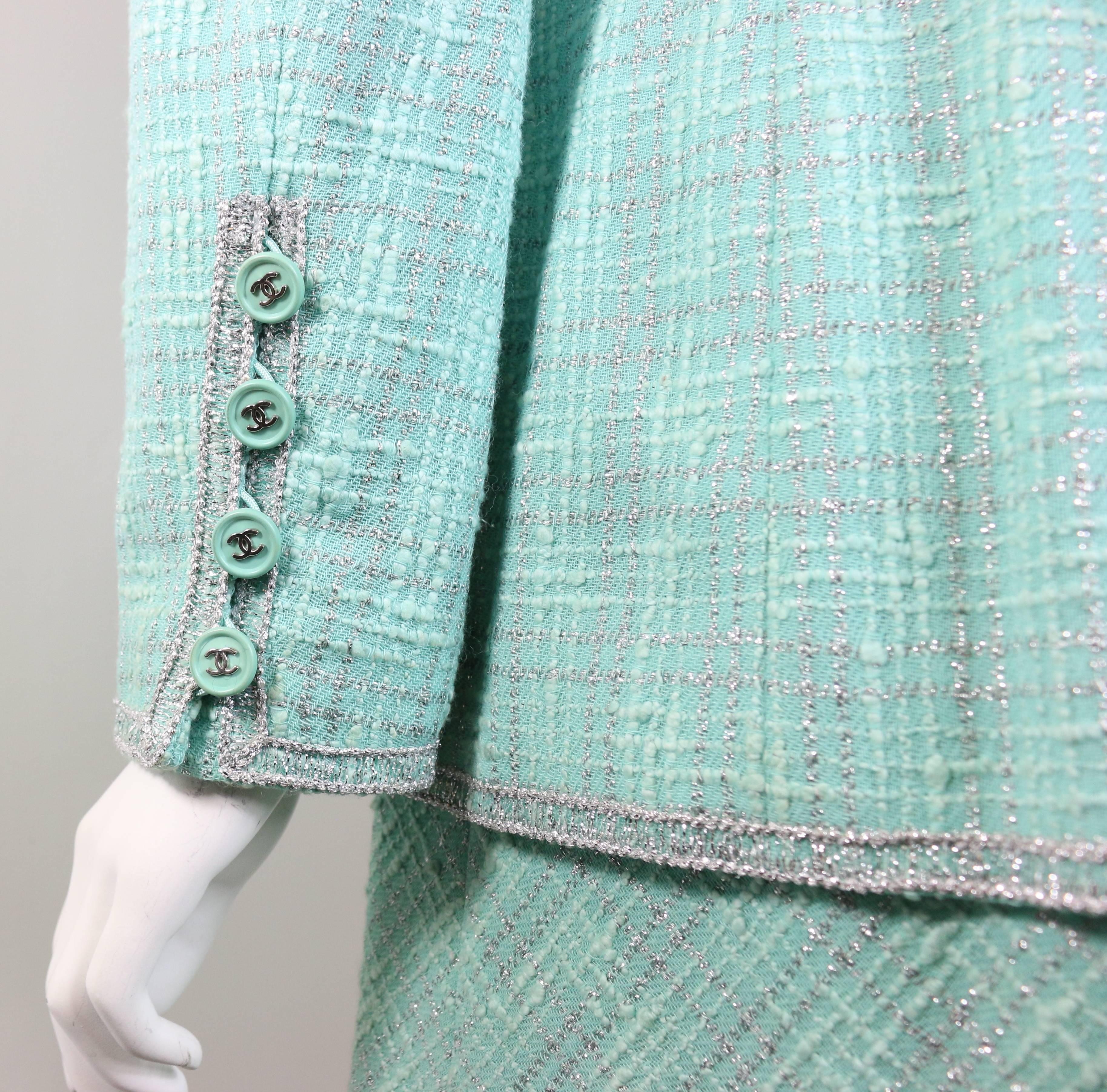 - Chanel green/silver tweed dress suit ensemble from 1997 pre-collection. 

- This jacket is an open front jacket and round neck design.

- Double vent on front. 

- 45%Wool, 38%Cotton, 15%Metal, 29%Nylon. Lining: 100%Silk

- Jacket Height:
