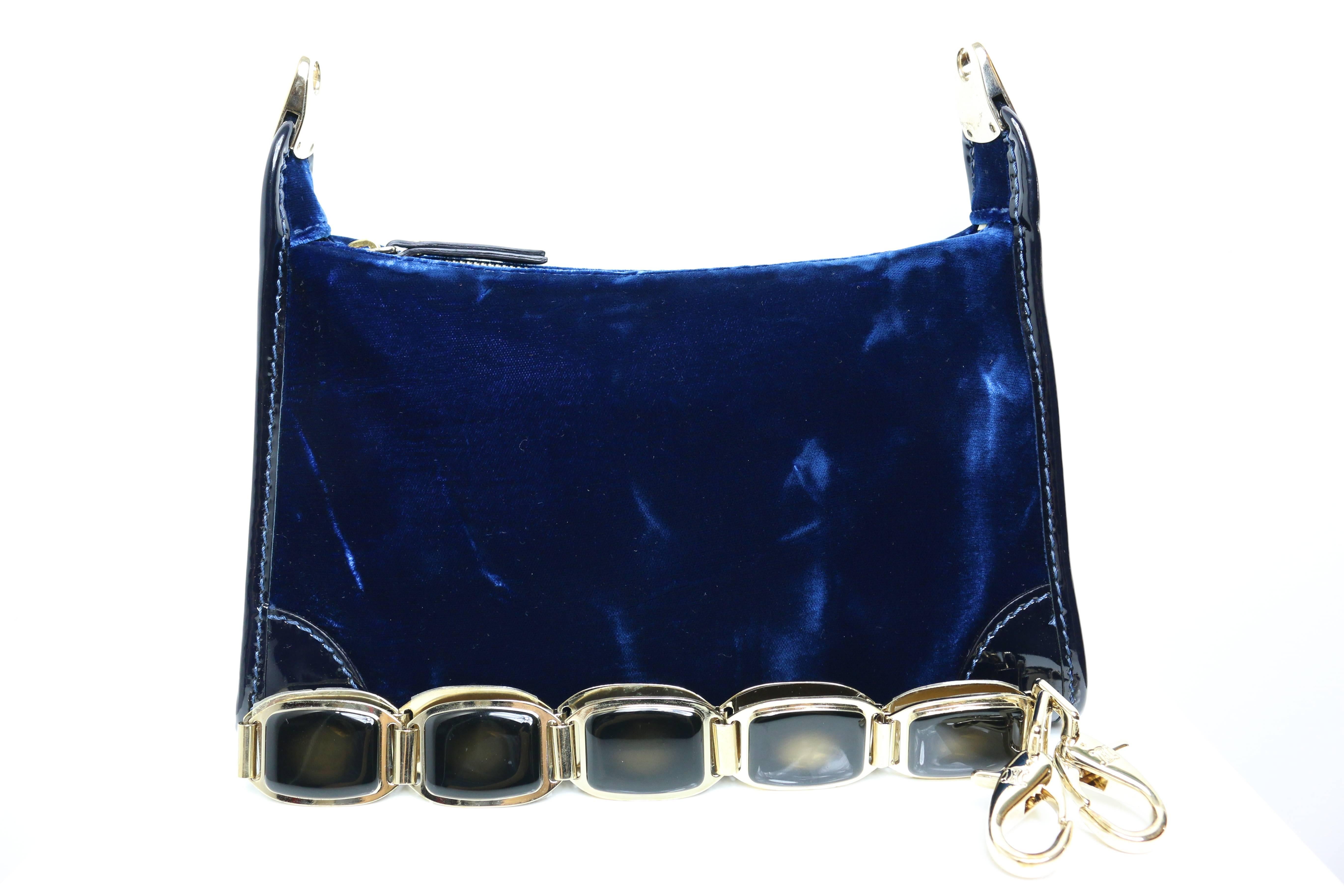 - Celine blue velvet strap bag. 

- Featuring a detachable olive gold metal hardware strap. 

- Patent leather piping trimmed. 

- Length: 10.25 in I Height: 8.5in I Width: 3in I Chain: 23.75in .

