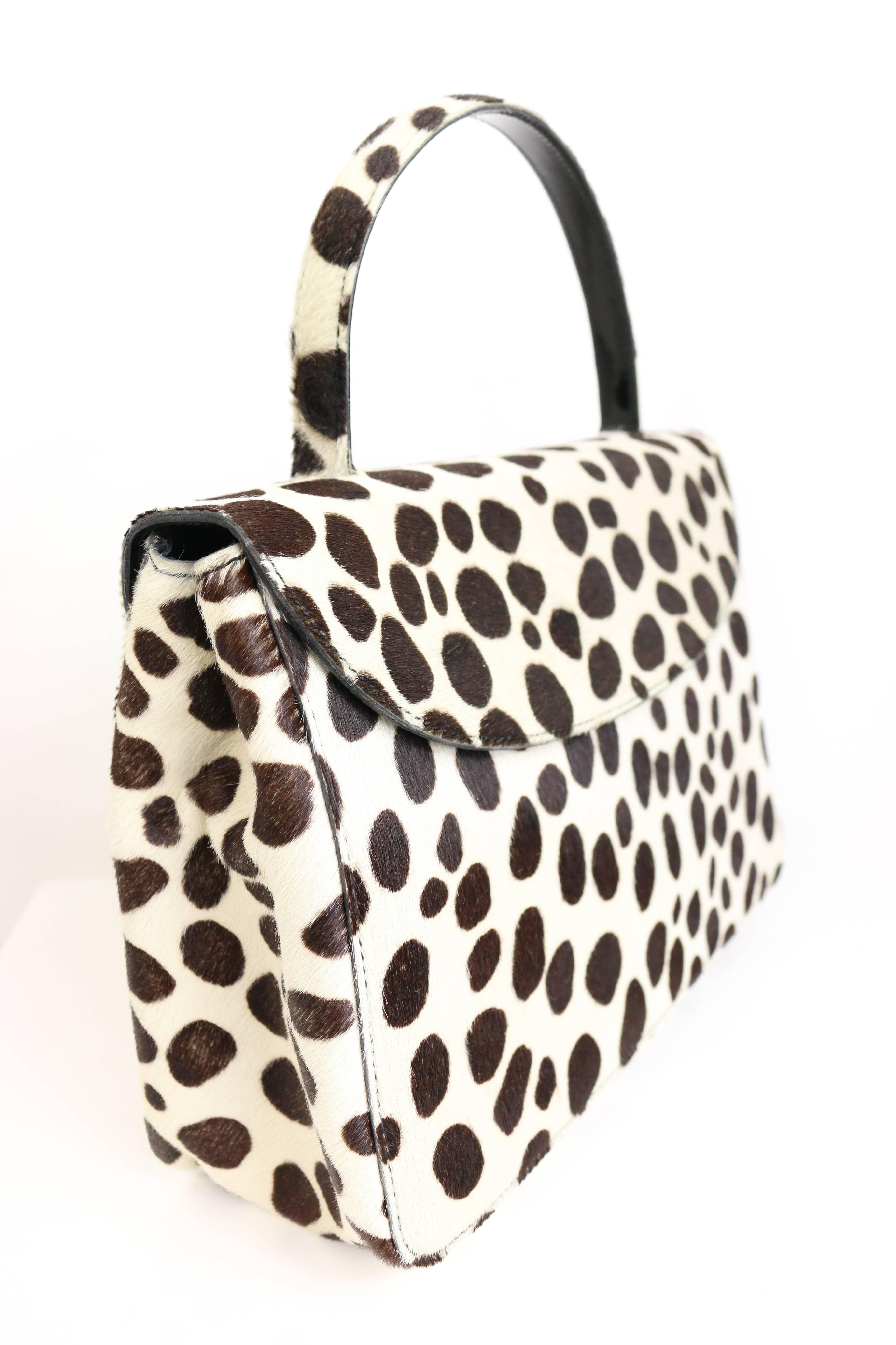 - Vintage 90s Prada leopard print pony hair flap handbag. 

-  Length: 10in I Height: 7in I Handle: 3.5 I Width: 3in.  
