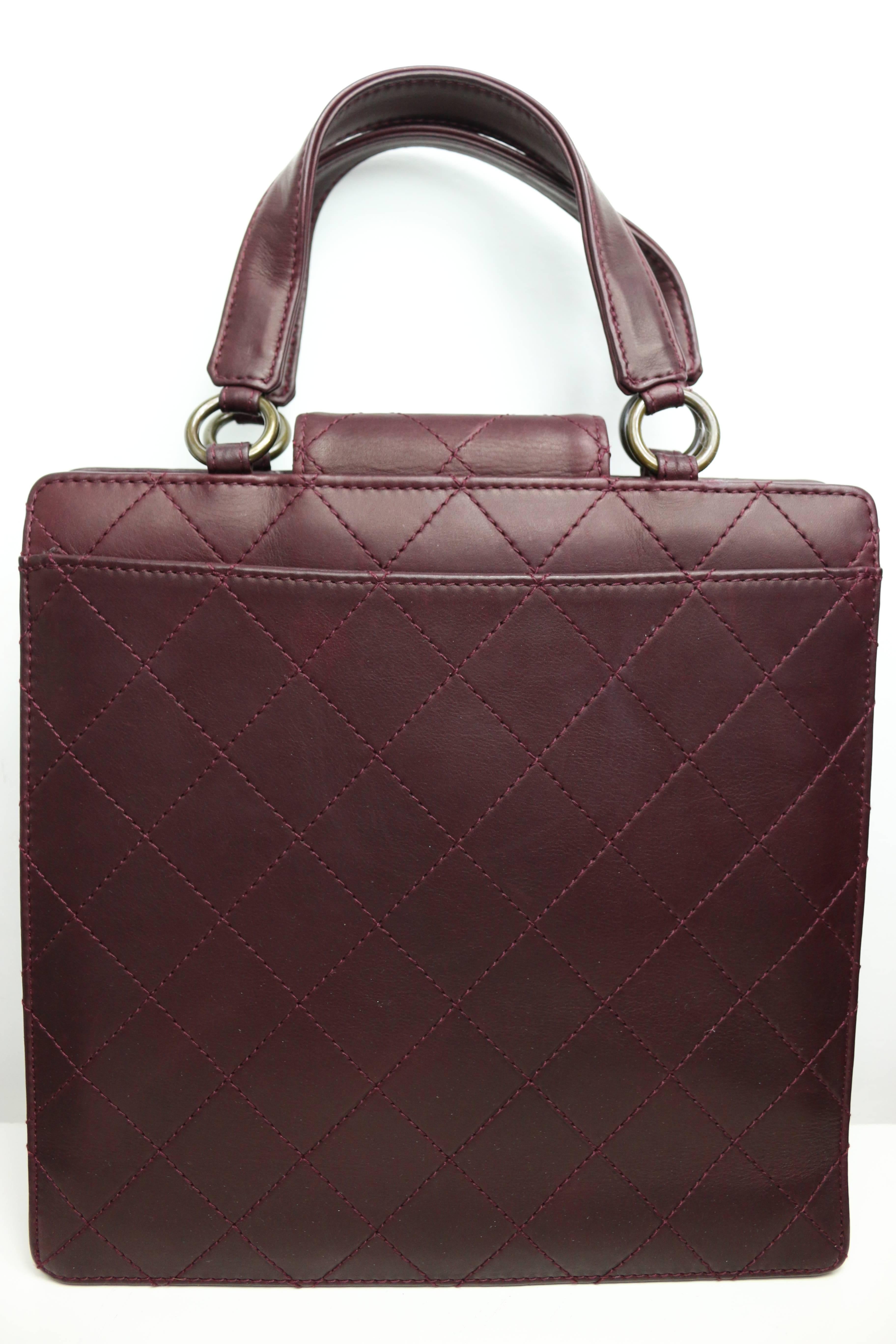 - Vintage Chanel burgundy quilted lambskin leather flap bag from 1996 to 1997. 

- Featuring two straps handle with four copper hardwares. 

- Height: 24cm I Length: 25cm I Strap: 10cm I Width: 8cm. 

- It comes with authenticity card, original box