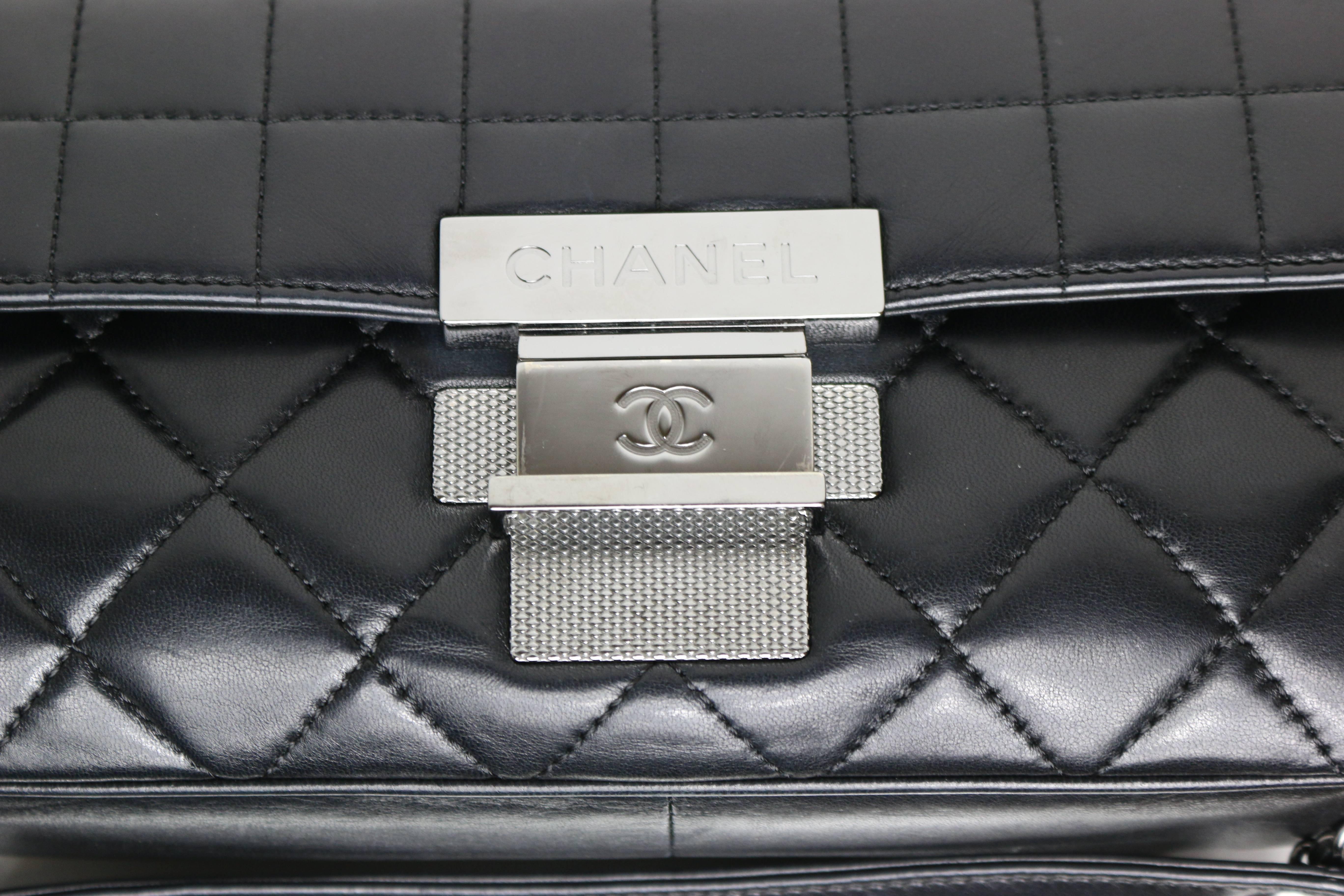 - Chanel black quilted lambskin leather motorcycle style silver chain shoulder bag from 2003-2004 collection. 

- Height: 5in I Length: 11in I Silver Chain: 10in I Width: 2.5in. 

- Comes with authenticity card, original box but no dust bag. 

-