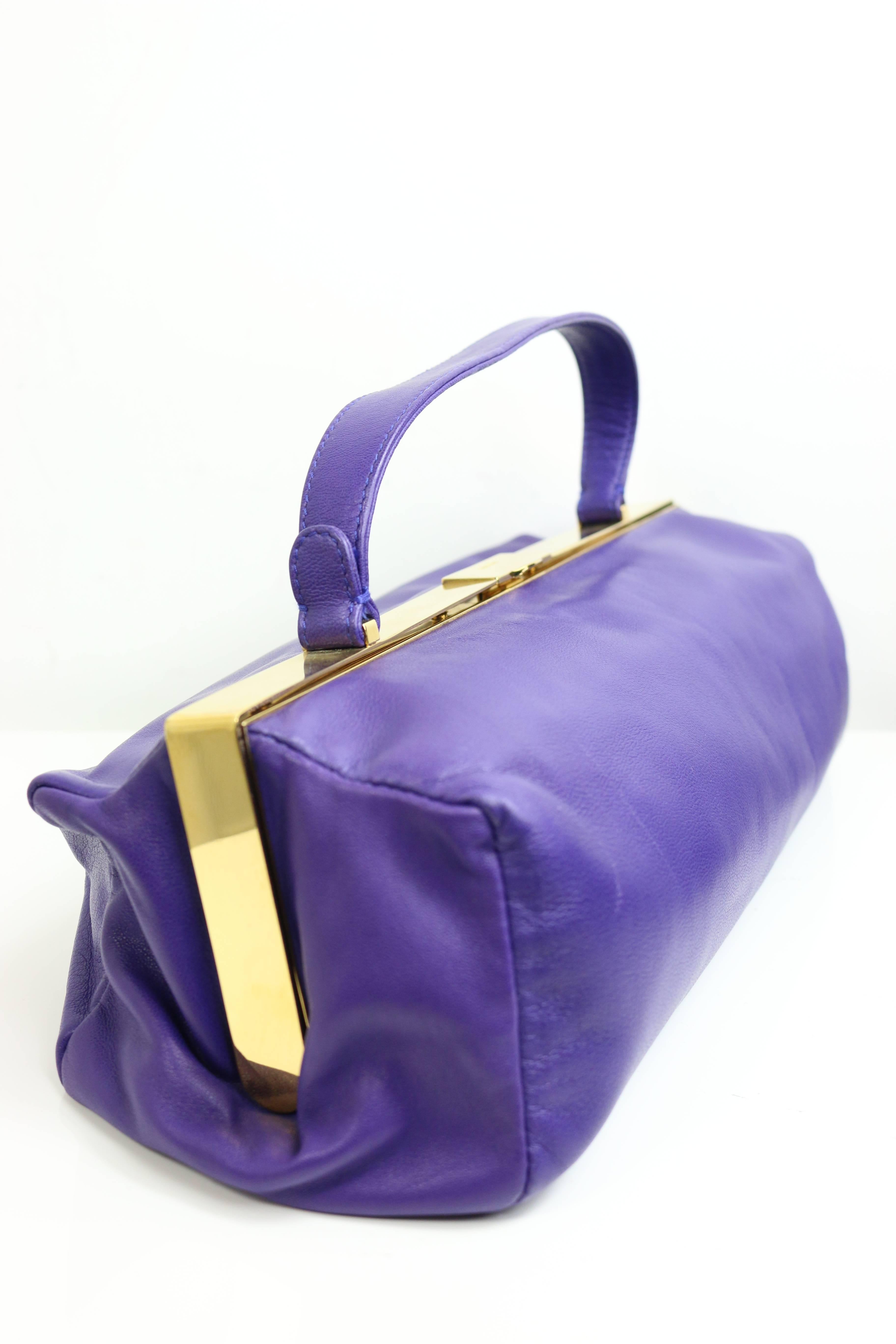 - Miu Miu purple leather rectangle shape handbag. 

- Length: 12in I Height: 4in I Width: 4.5in I Strap: 4in
(all measurements are approximate). 
