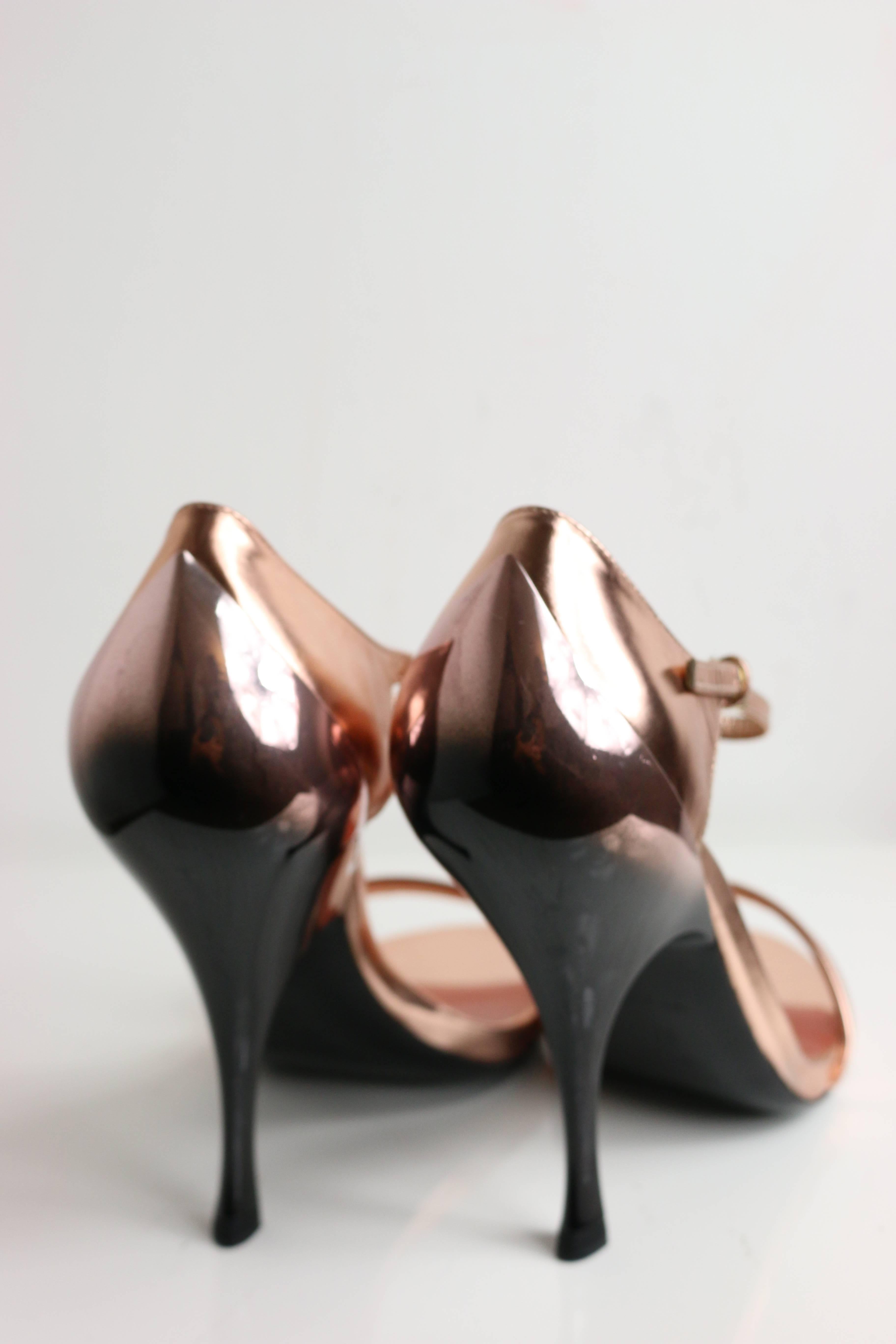 - Miu Miu rose gold metallic leather sandals featuring a mirror like heels. 

- Made in italy. 

- SIze 39. 

- Length: 7in I Heels: 6.5in (measurements are approximate). 


