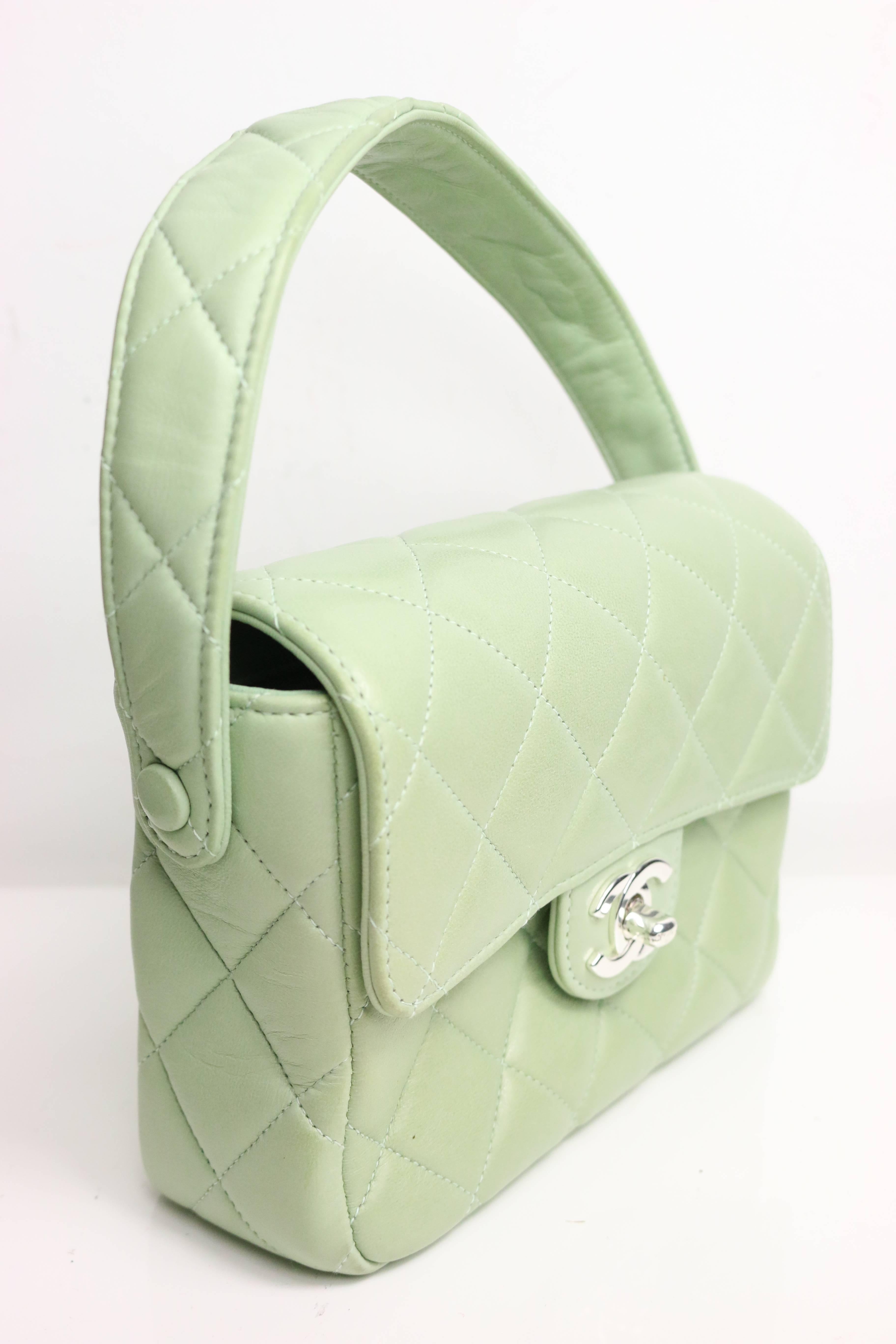 - Chanel green lambskin leather quilted mini flap strap handbag from 1996-1997 collection.  

 - Long: 17cm I Height(with strap): 19cm I Width: 6cm. 

- Includes: Authenticity card, box. 

- Condition: Excellent preowned condition. Please note this