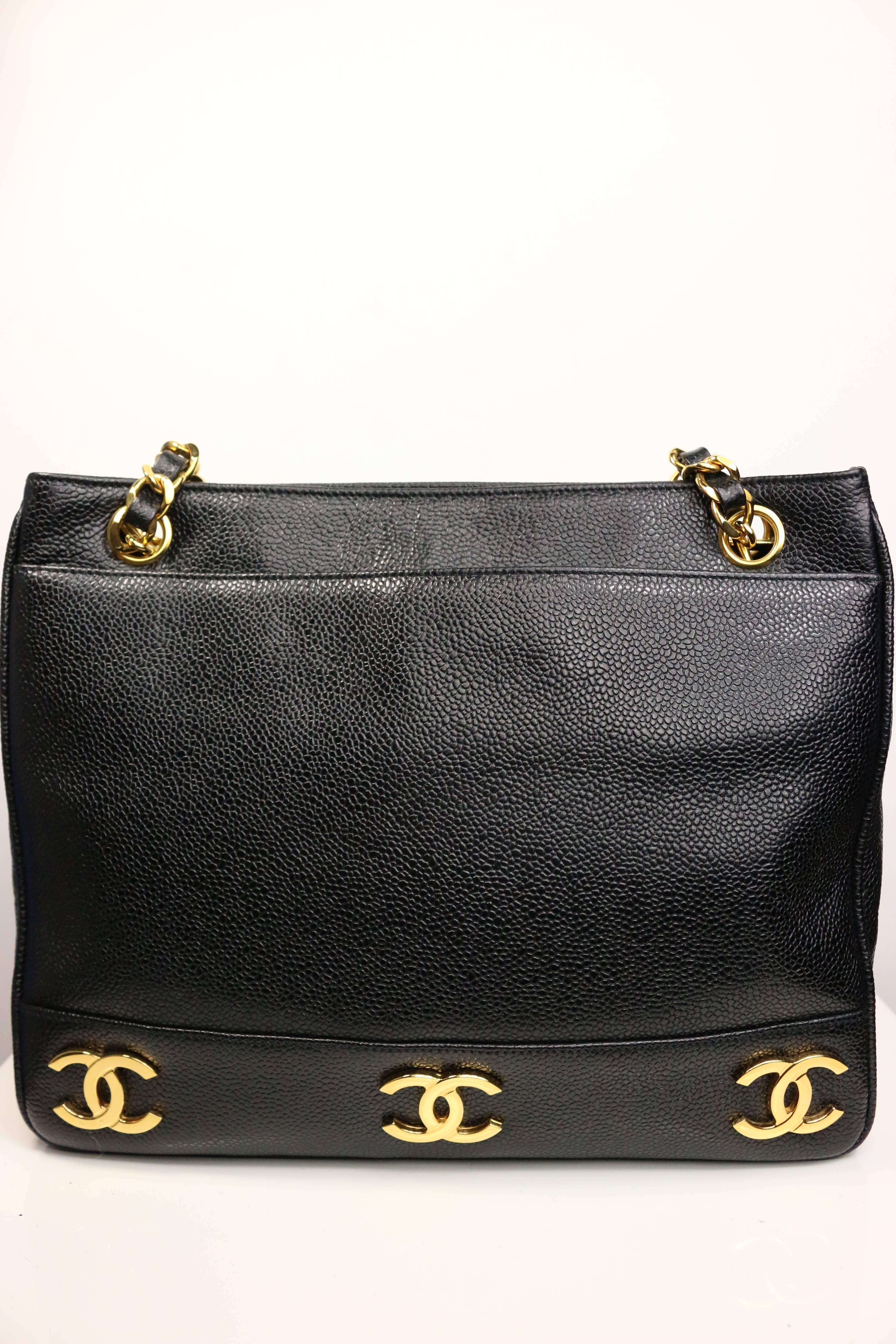 - Chanel black caviar leather gold "CC" logo shopping tote from early 90s collection. Its a black and gold Chanel classic and vintage bag combination! 

- Featuring gold hardware caviar leather strap and eight gold "CC" logo on