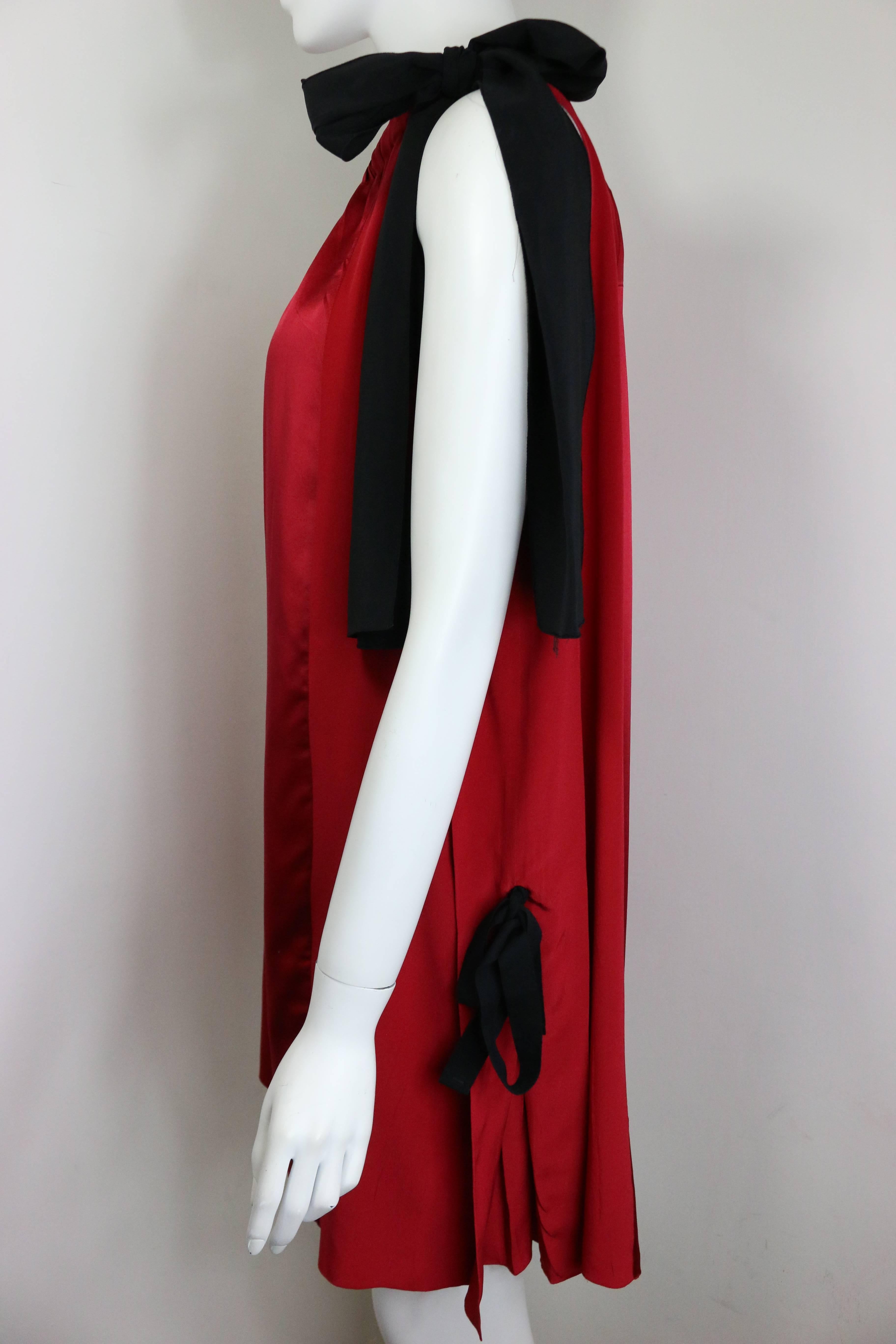 - Prada Burgundy panel satin and silk sleeveless cocktail dress. 

- Featuring two black tied ribbons on the side of the dress. 

- Size 42 IT

- 100 % Silk. 
