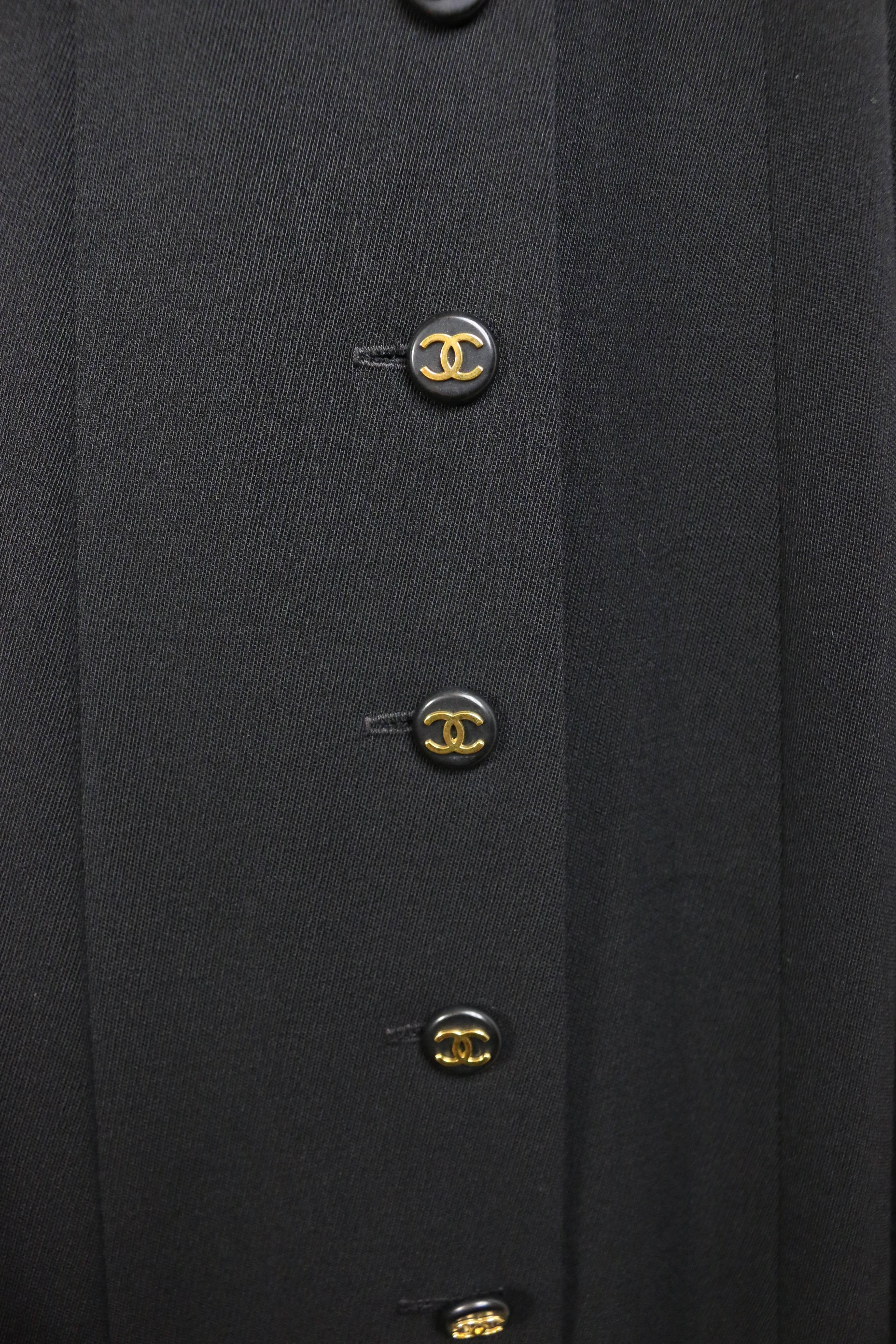 - Vintage Chanel black wool A-Line long skirt from 1994 collection. 

- Featuring ten front panel gold "CC" logo buttons and two side pockets. 

- Size 38. 

- 100% Wool, 100% Silk double lining. 

