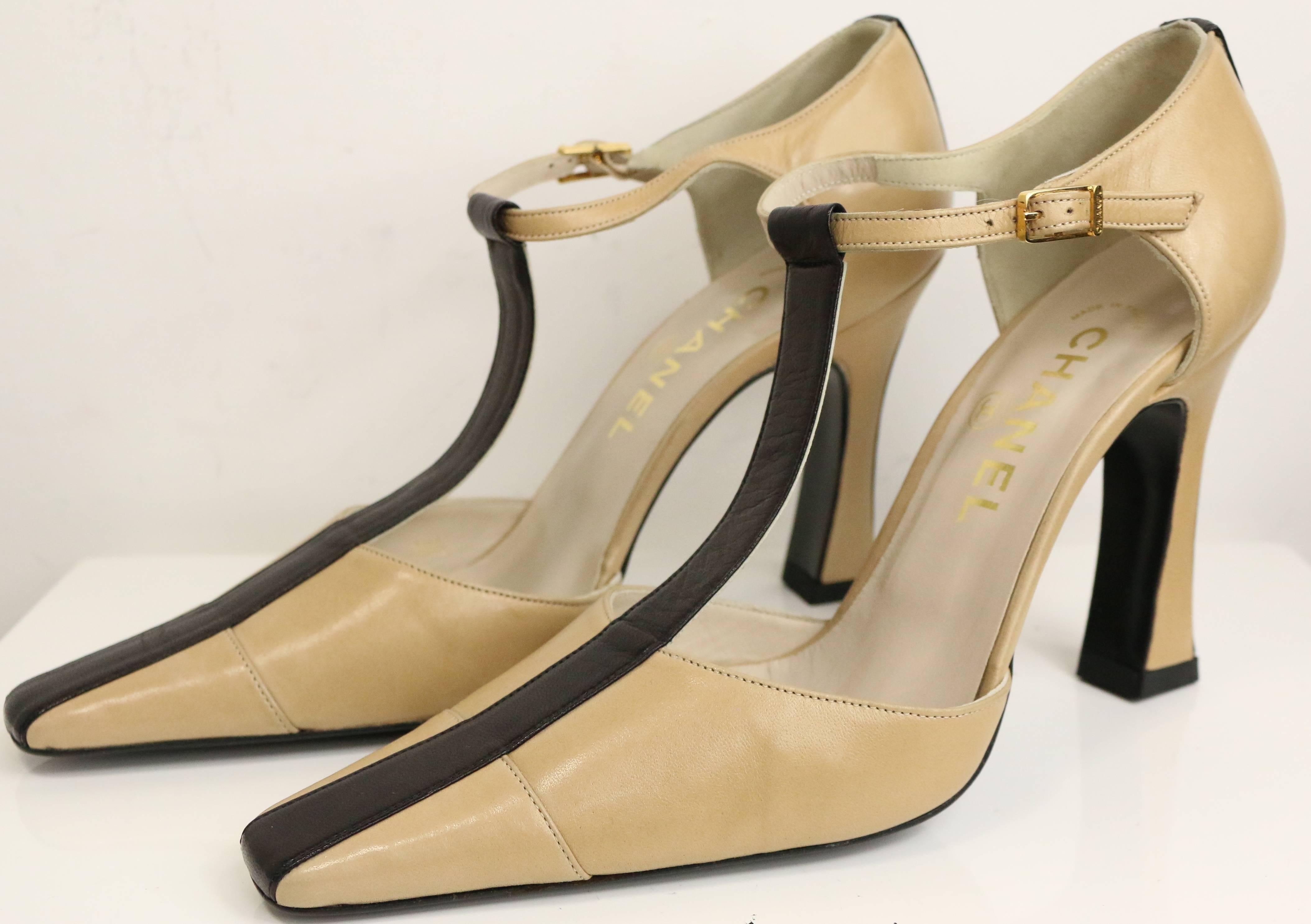 - Chanel bi tones beige/black strap heels. 

- Size 38.5. 

- Made in Italy. 

- Length: 9in I Heels: 4in (approximately measurement)


