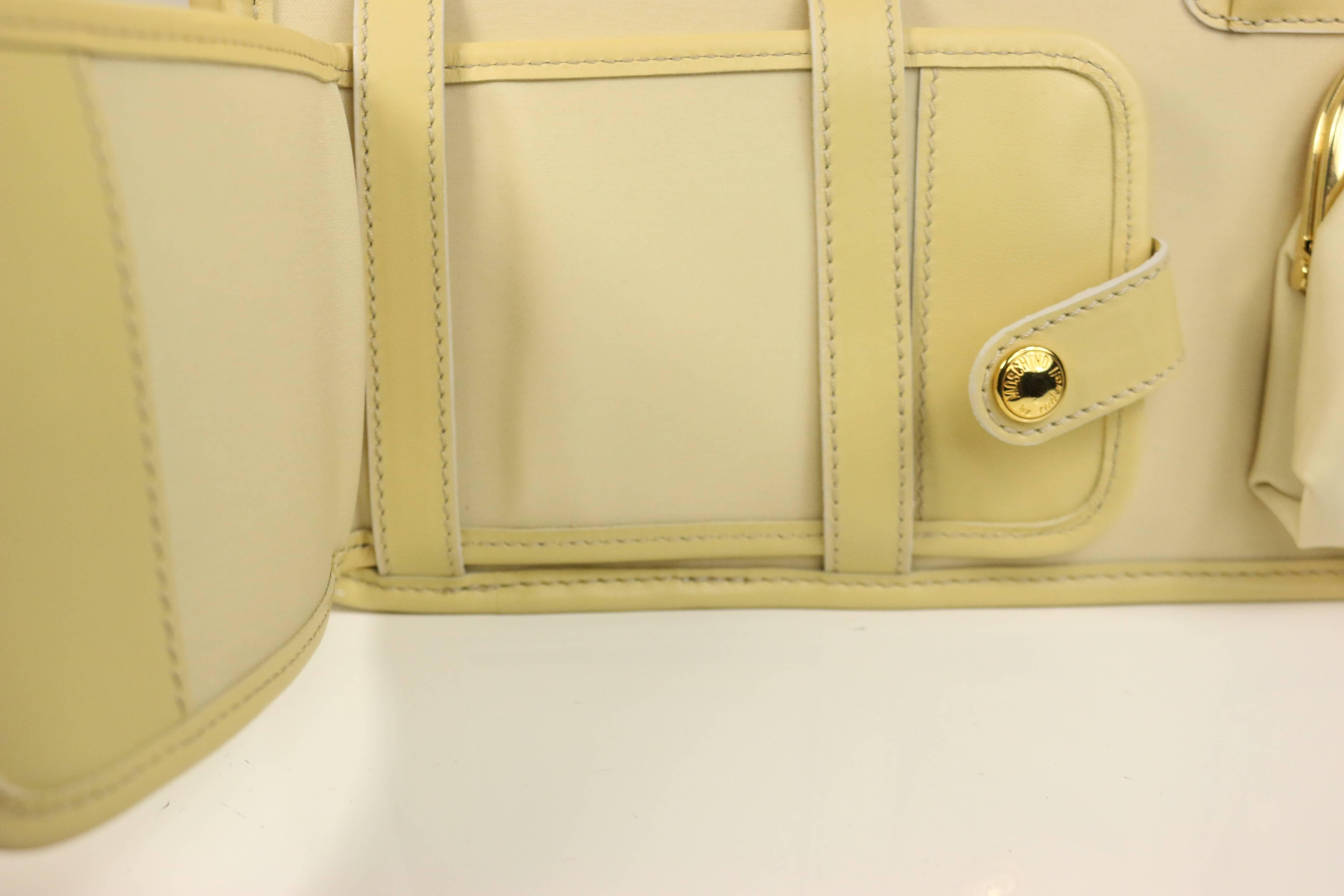 - This vintage 90s Moschino by Redwall cream nylon tote strap bag with genuine leather details is rare and fun to carry.  It is like a woman 
