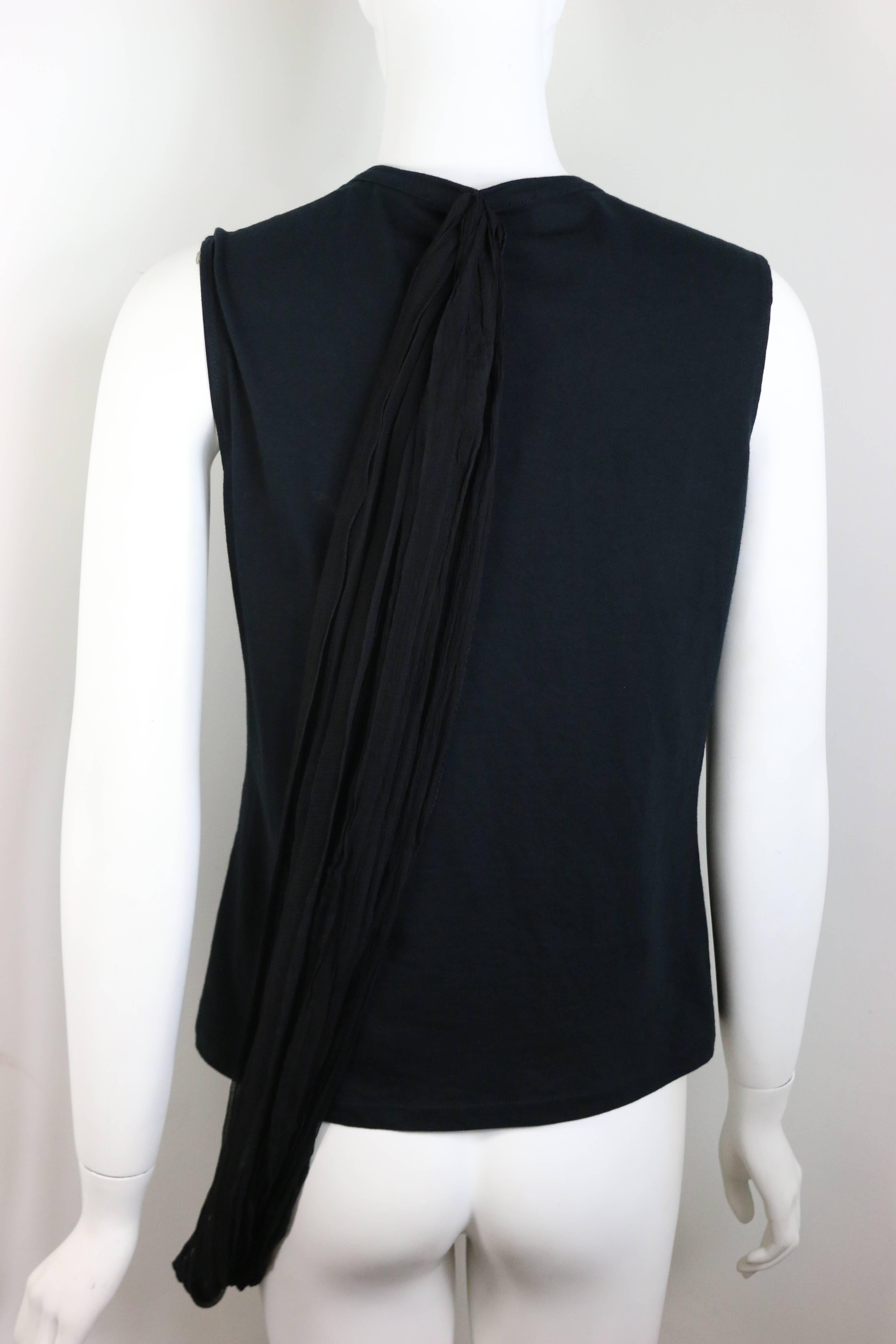 - This Dior black tank top from early 2000s John Galliano. It has a black silk wrapping details connected from the bottom front to the back top. You can play around the wrap the way you want wrapping around your body. 

- Size 42 FR, USA 10. 

-