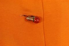 Chloe Orange Cropped Vest And Skirt Ensemble With Light Bulb Buttons