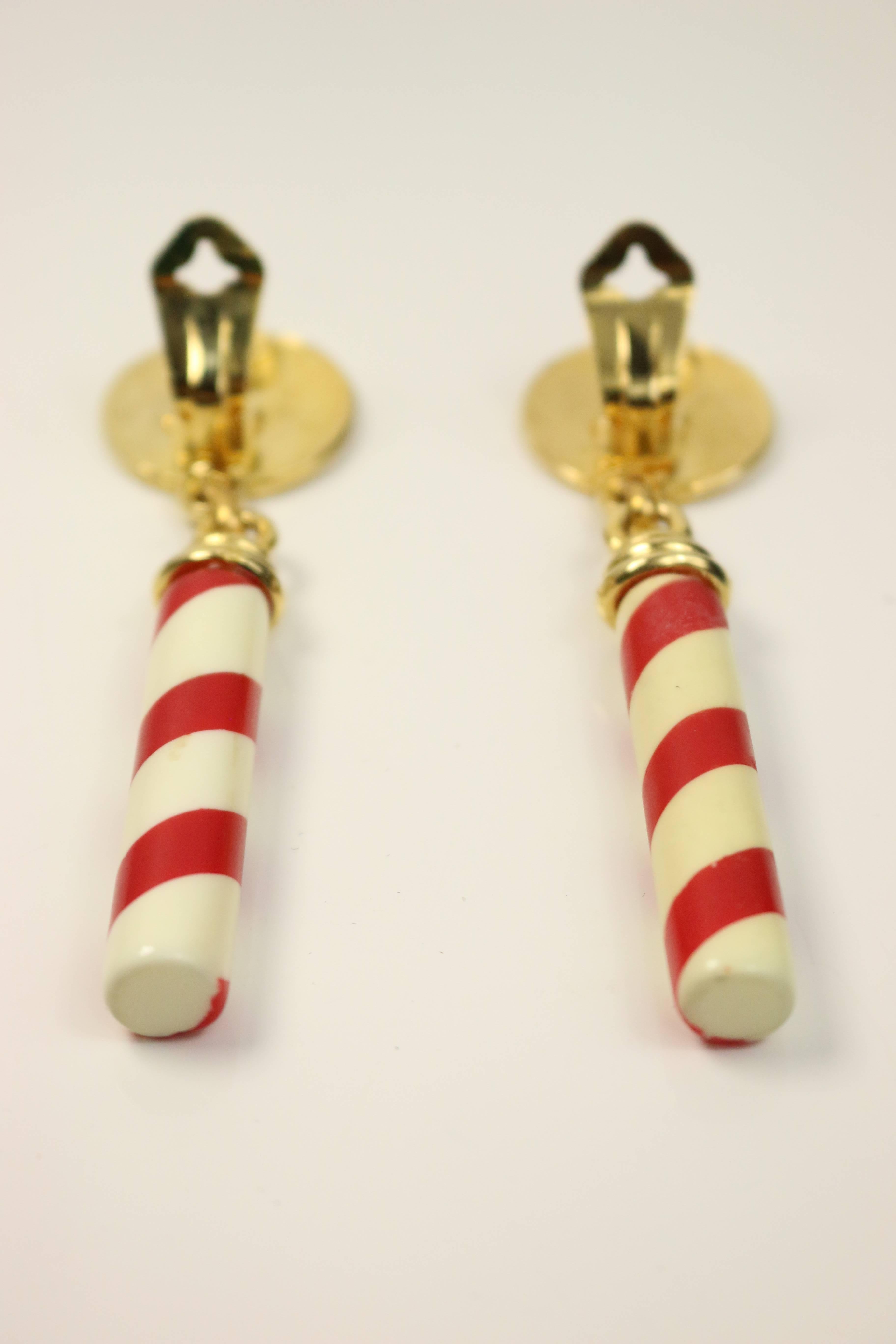 - Vintage 90s Moschino gold tone candy cane drop clip-on earrings with "Moschino Milano" written on it.  Very pop art with fun and funky Moschino style. Great for summer! 

- Height: 3.25in. 

-  Made in Italy. 