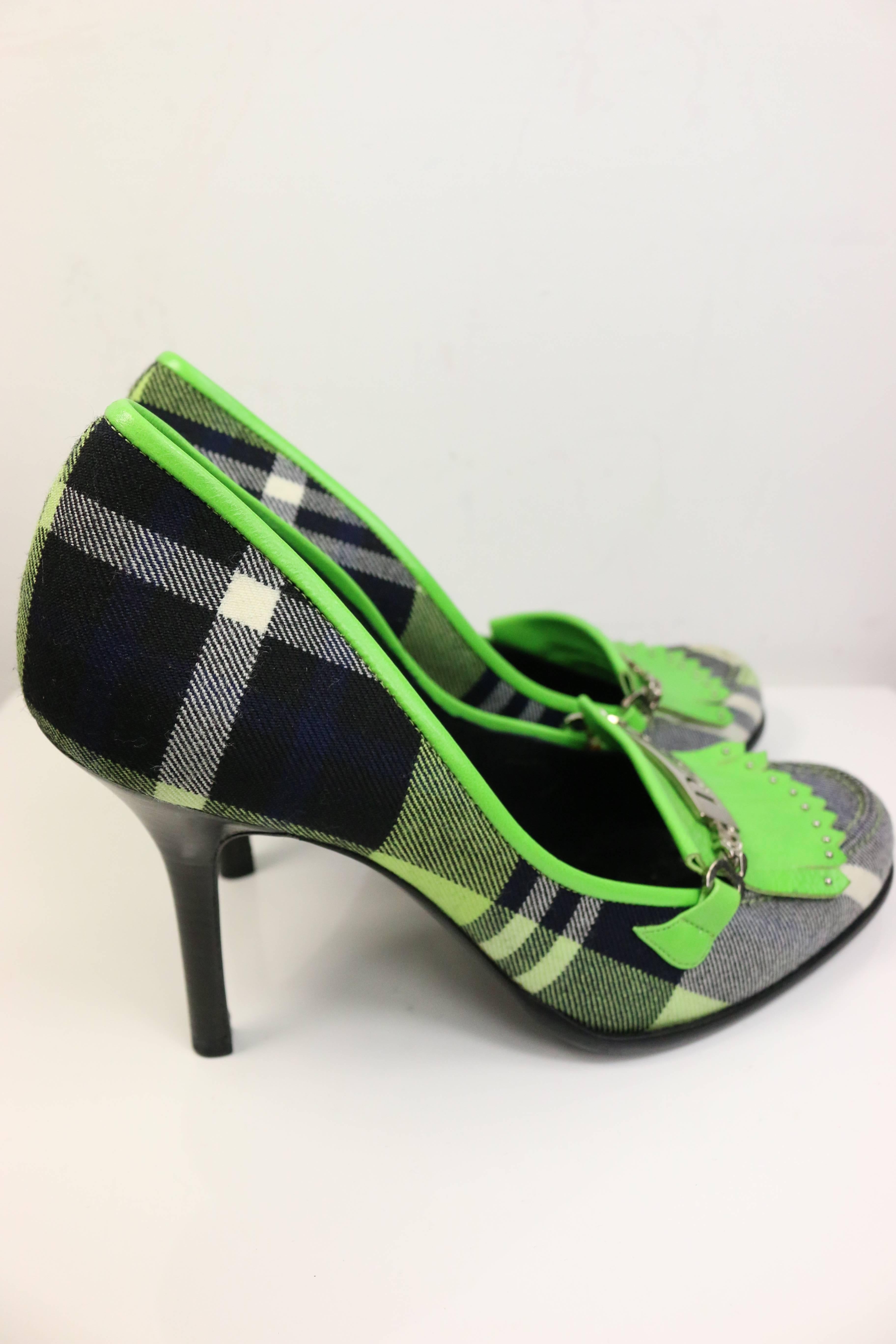 - Christian Dior by John Galliano green leather plaid fringe pumps. 

- Featuring silver hardware written 