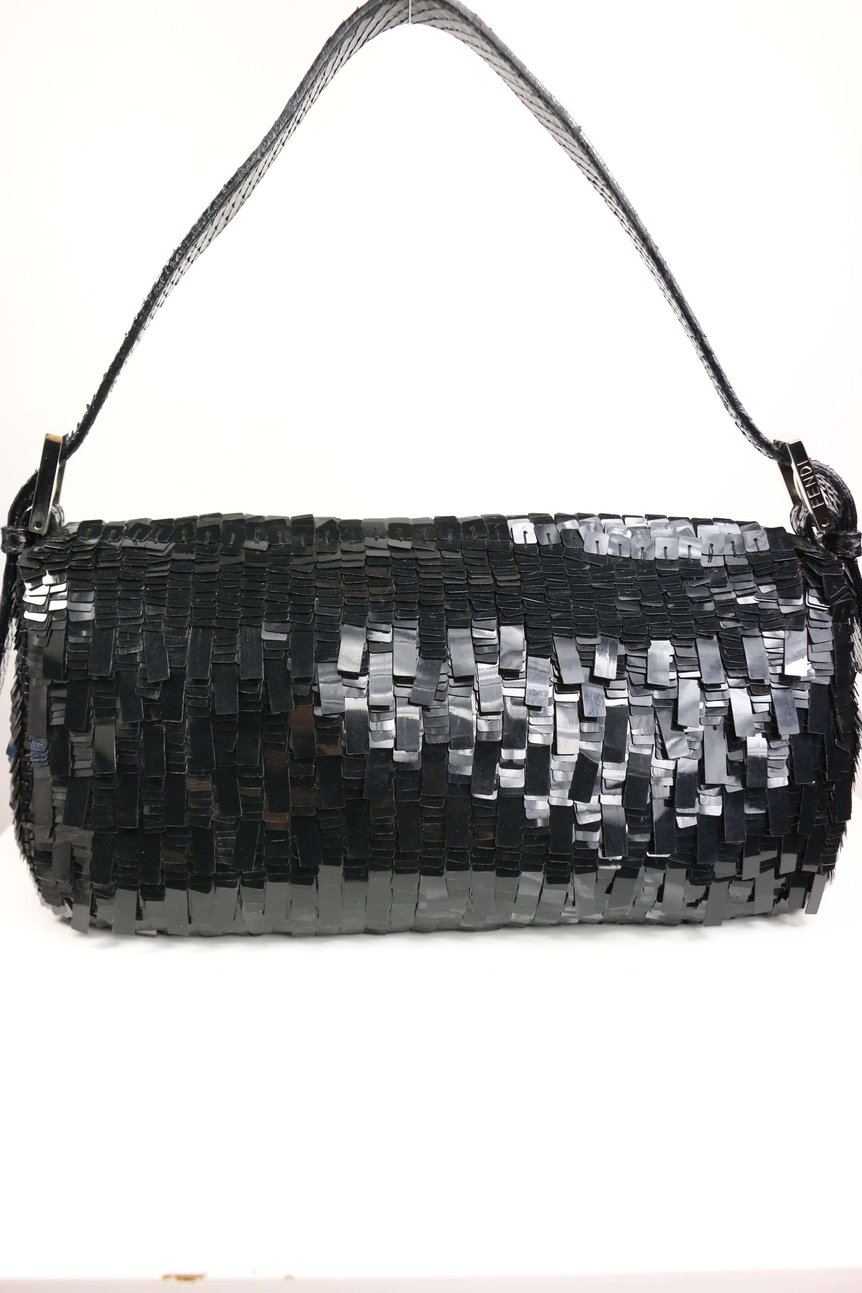 - Fendi classic black sequin and black bead edge baguette handbag with snakeskin front panel "FF" silver hardware, the snakeskin handle strap with two adjustable silver hardware buckles written word "Fendi" on it. 

- Made in