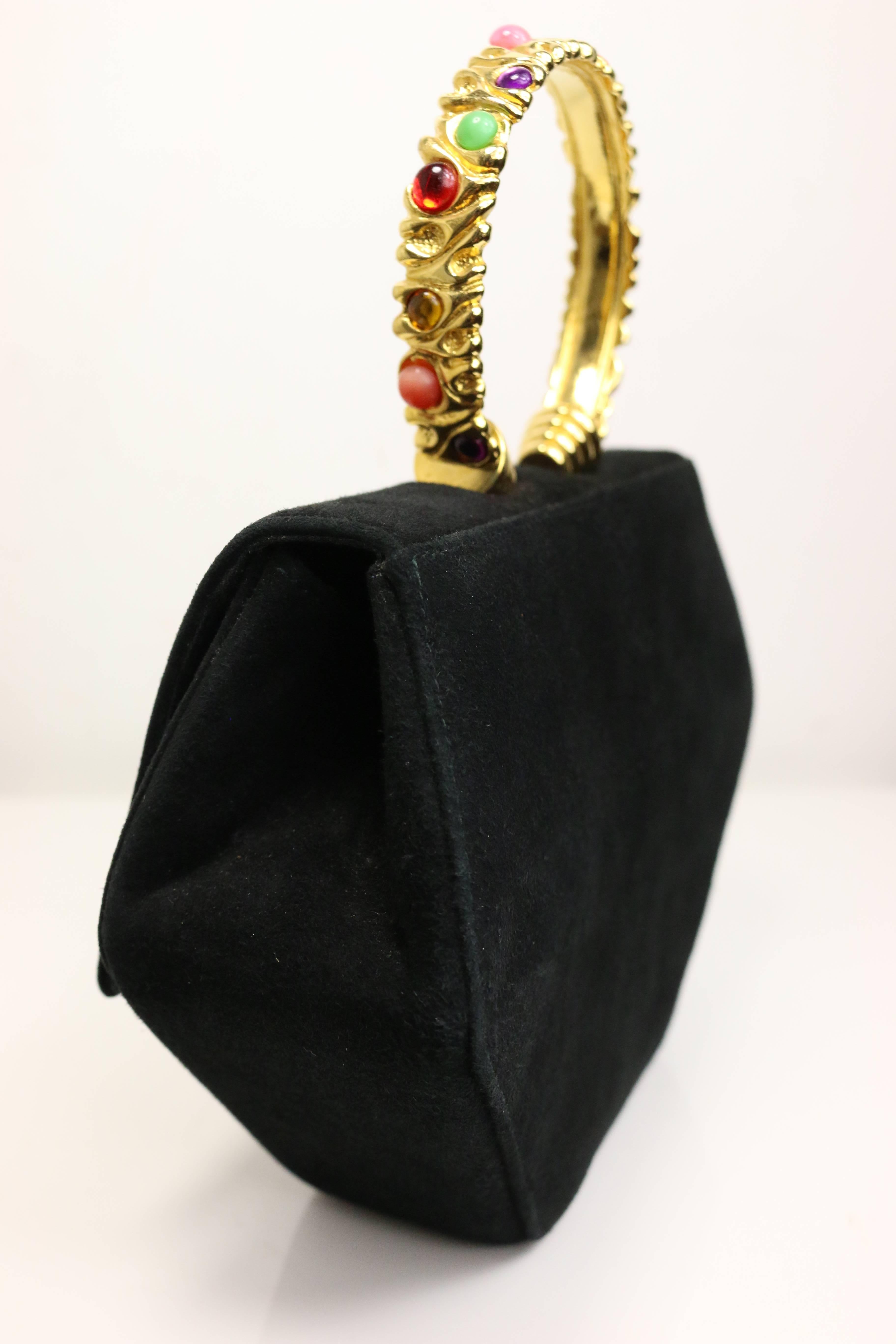 - Vintage 80s Rodo black suede with gold toned handle octagon handbag with strap. 

- Featuring fourteen multicoloured(red, pink, green, yellow, purple, black) stones gold toned handle. 

- Length: 7.5 inches. Height: 9 inches. Width: 2.5