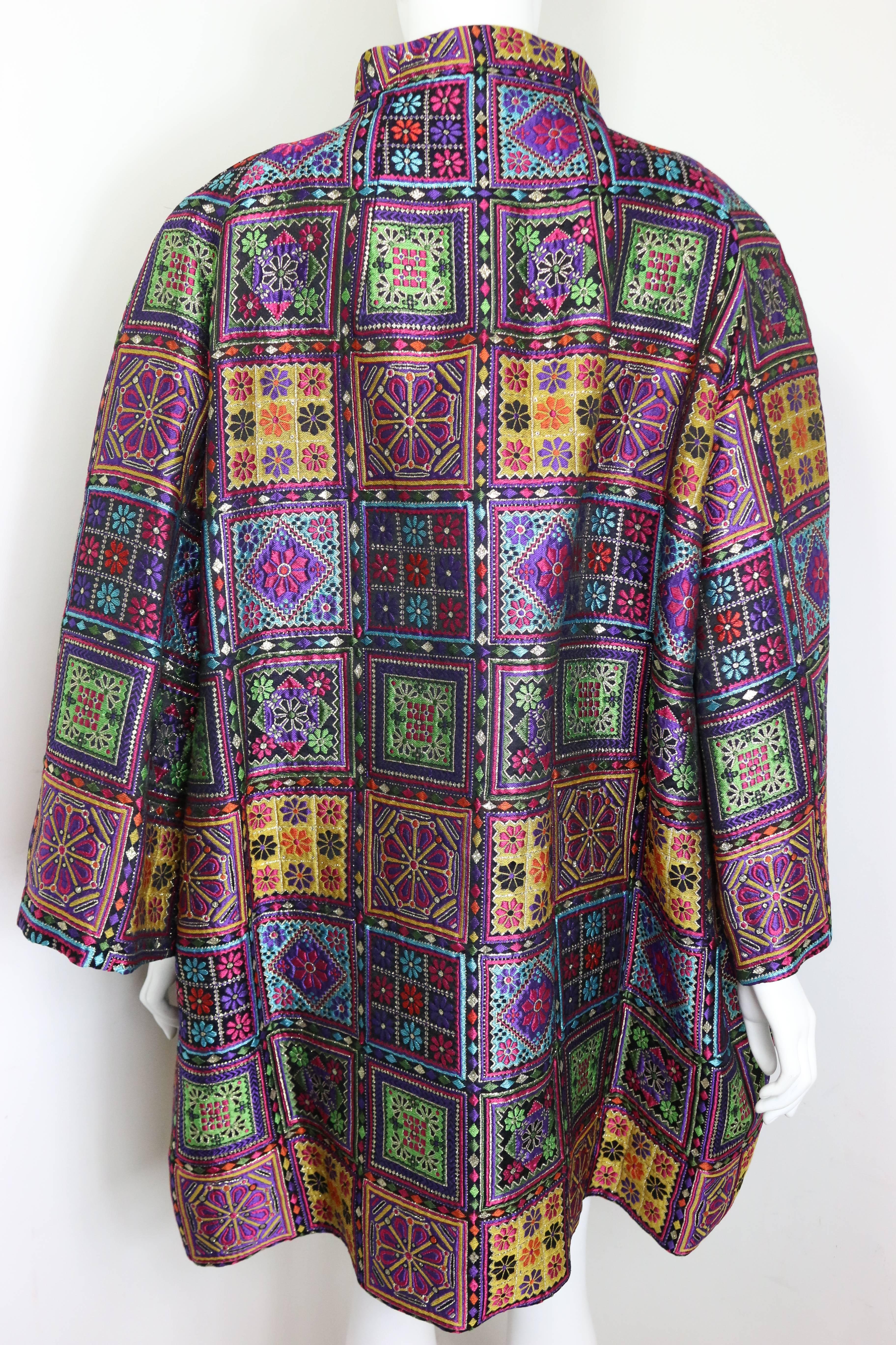 - Vintage Christian Lacroix embroidered multicolour floral prints clutch coat from Fall 1991 collection. 

- Featuring stand collar, long sleeves, two side pockets and black quilted lining. 

- 31% Polyester, 30% Acrylic, 25% Silk and 14%