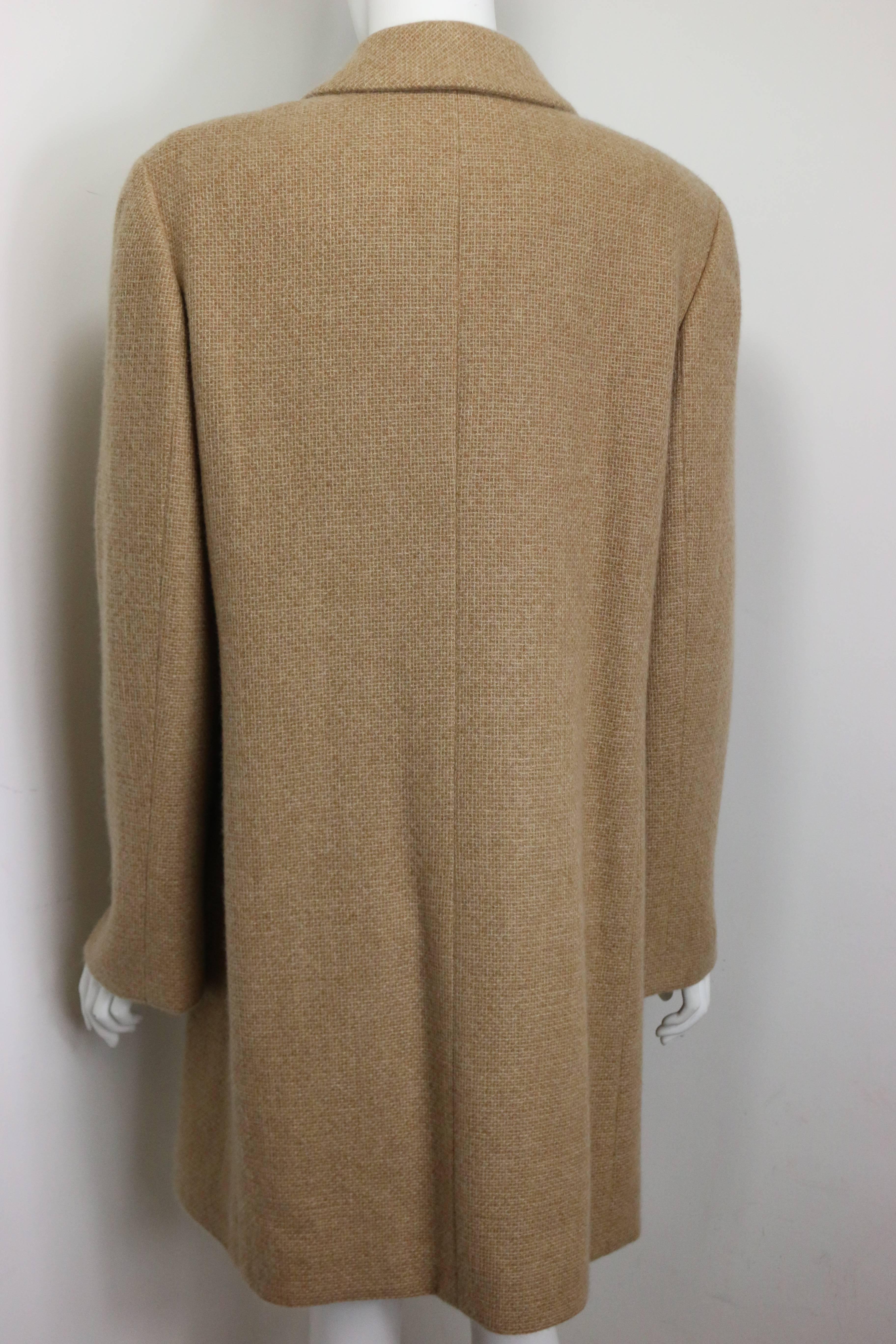 - Chanel camel cashmere long coat from Fall 2000 collection. This chic and pretty cashmere long coat is a truly collectable item!

- Featuring 