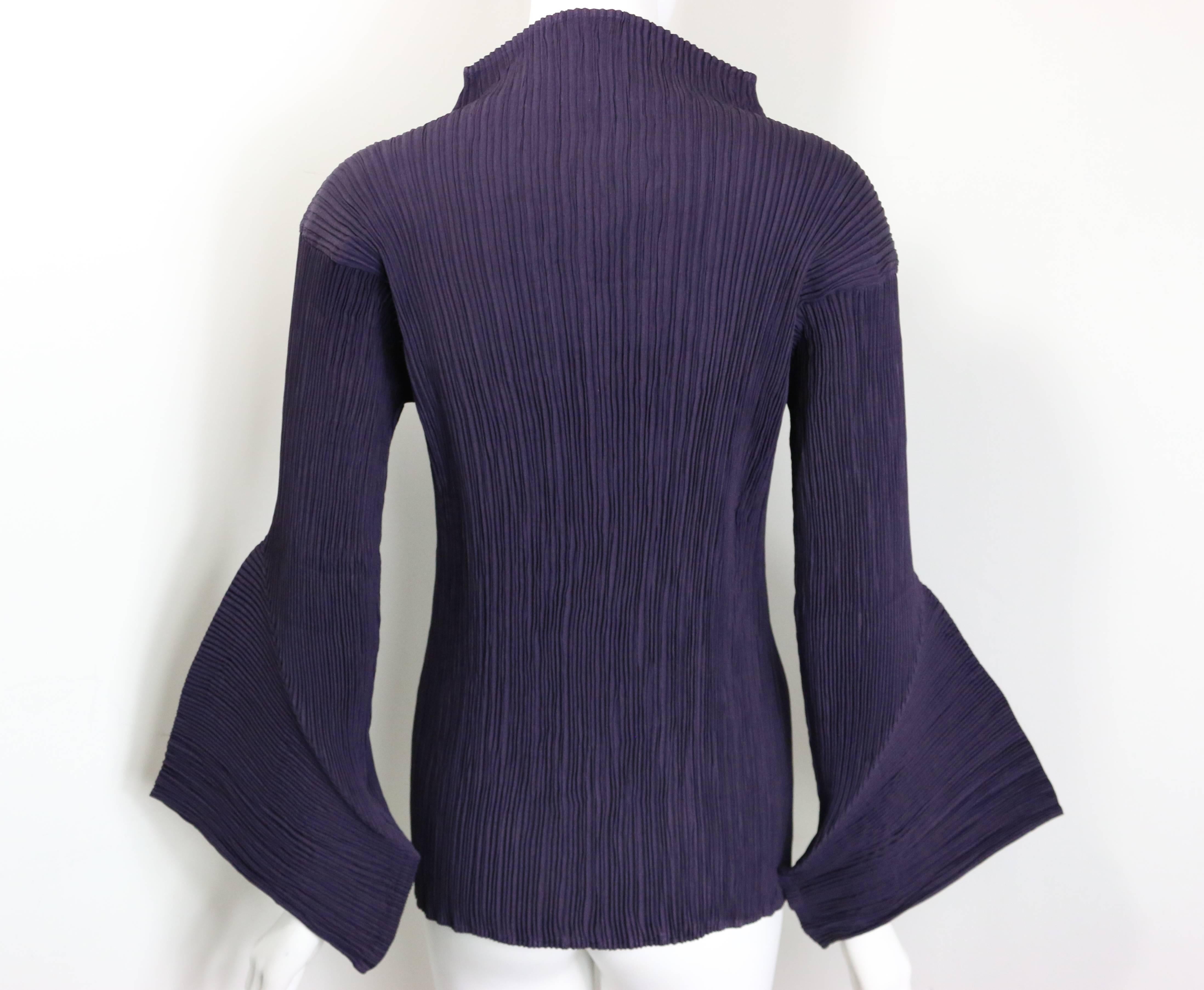- Vintage 90s Issey Miyake purple pleated high neckline with 3D sleeves top. This piece is one of a kind with sculptural sleeves which is signature for Issey Miyake!!! 

- Made in Japan. 

- Size M. 

- 100% Polyester. 

