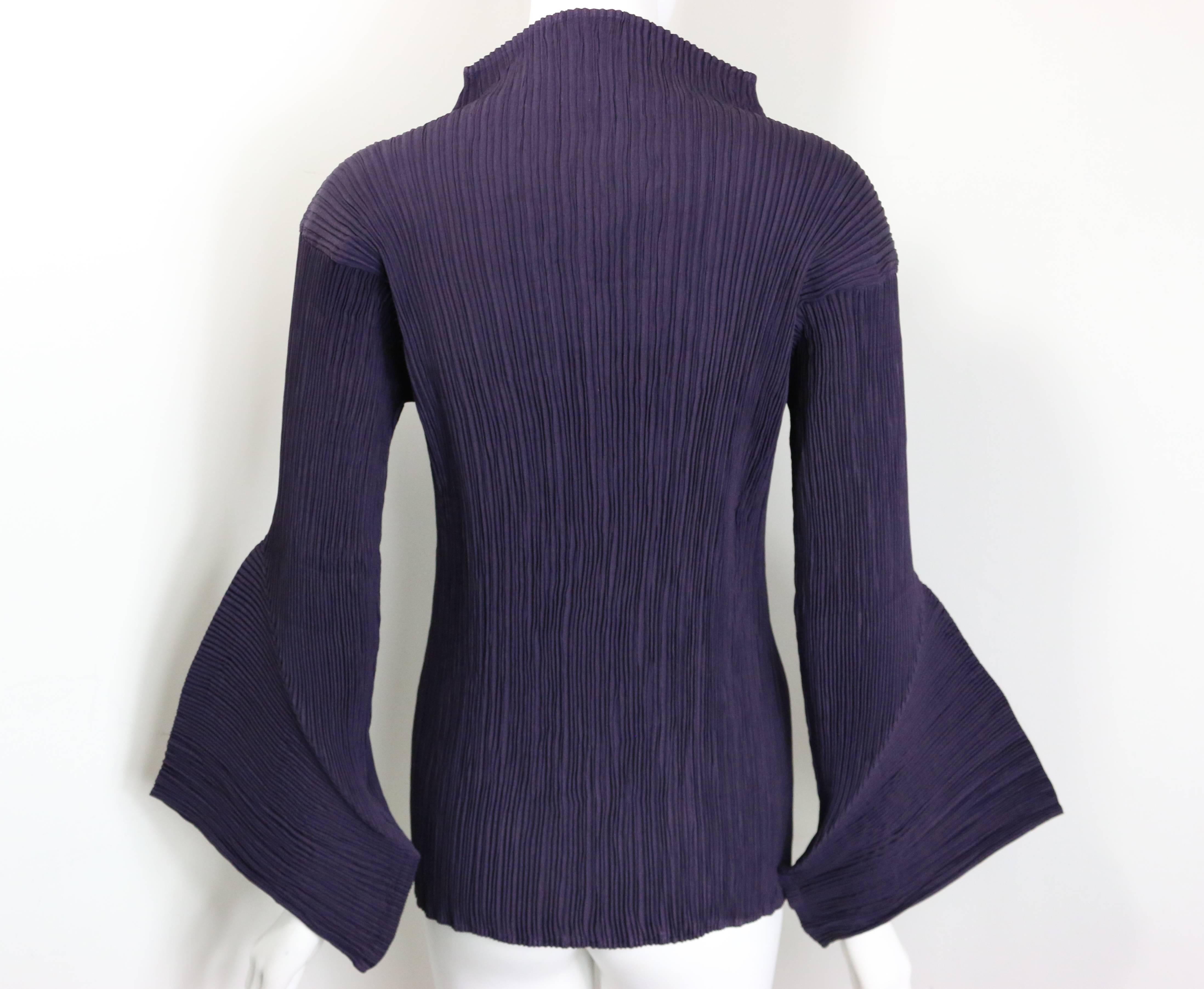 - Vintage 90s Issey Miyake purple pleated high neckline sleeves top. This piece is one of a kind with sculptural sleeves which is a signature of Issey Miyake!!! 

- Made in Japan. 

- Size M. 

- 100% Polyester. 

