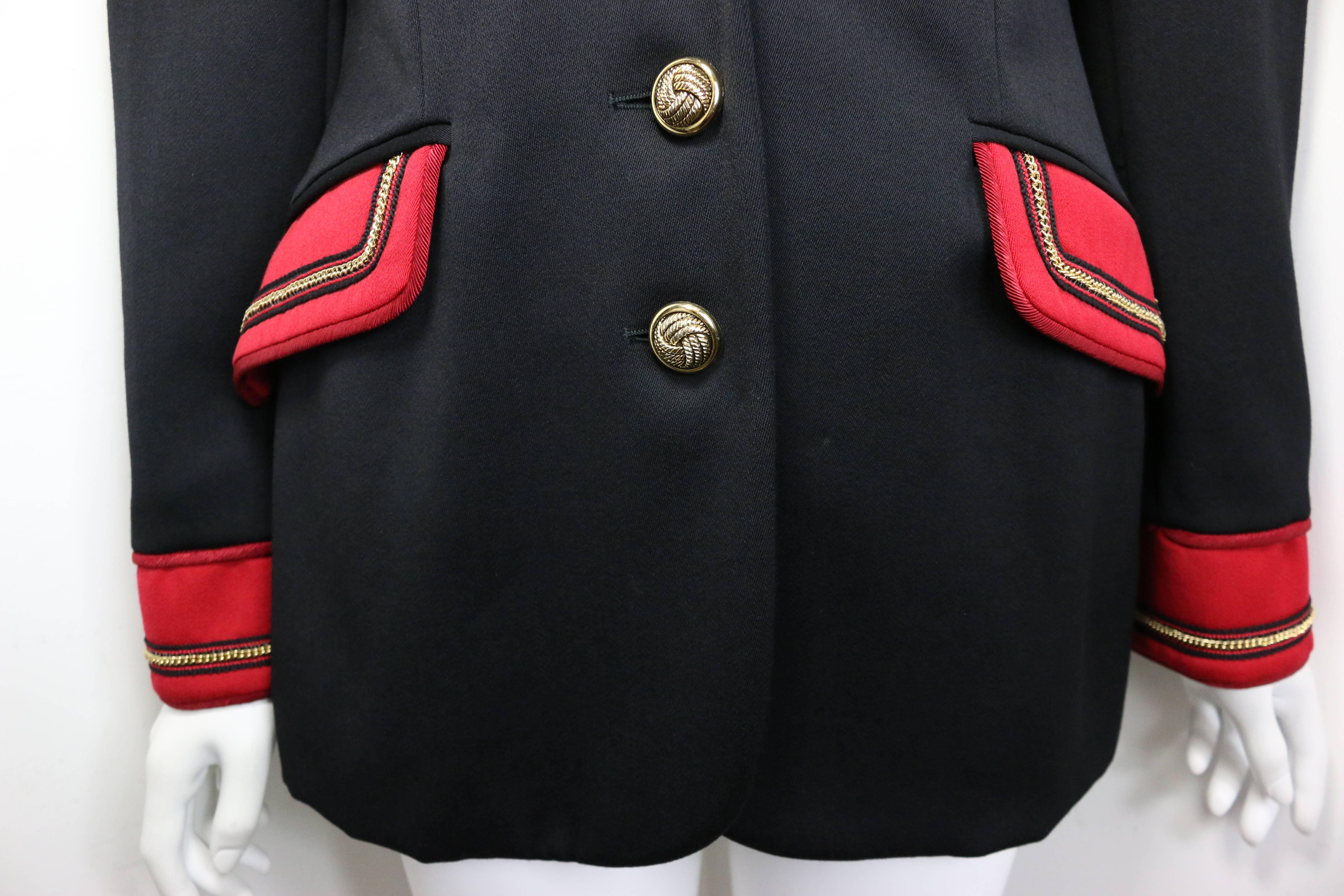 - Vintage 80s Alberta Ferretti Studio officer jacket in black. 

- Featuring red trim with gold link chain collar lapel, front flap pockets and cuffs. Three gold toned link buttons closing. 

- Made in Italy. 

- Size IT 42, US 8. 

- 100%