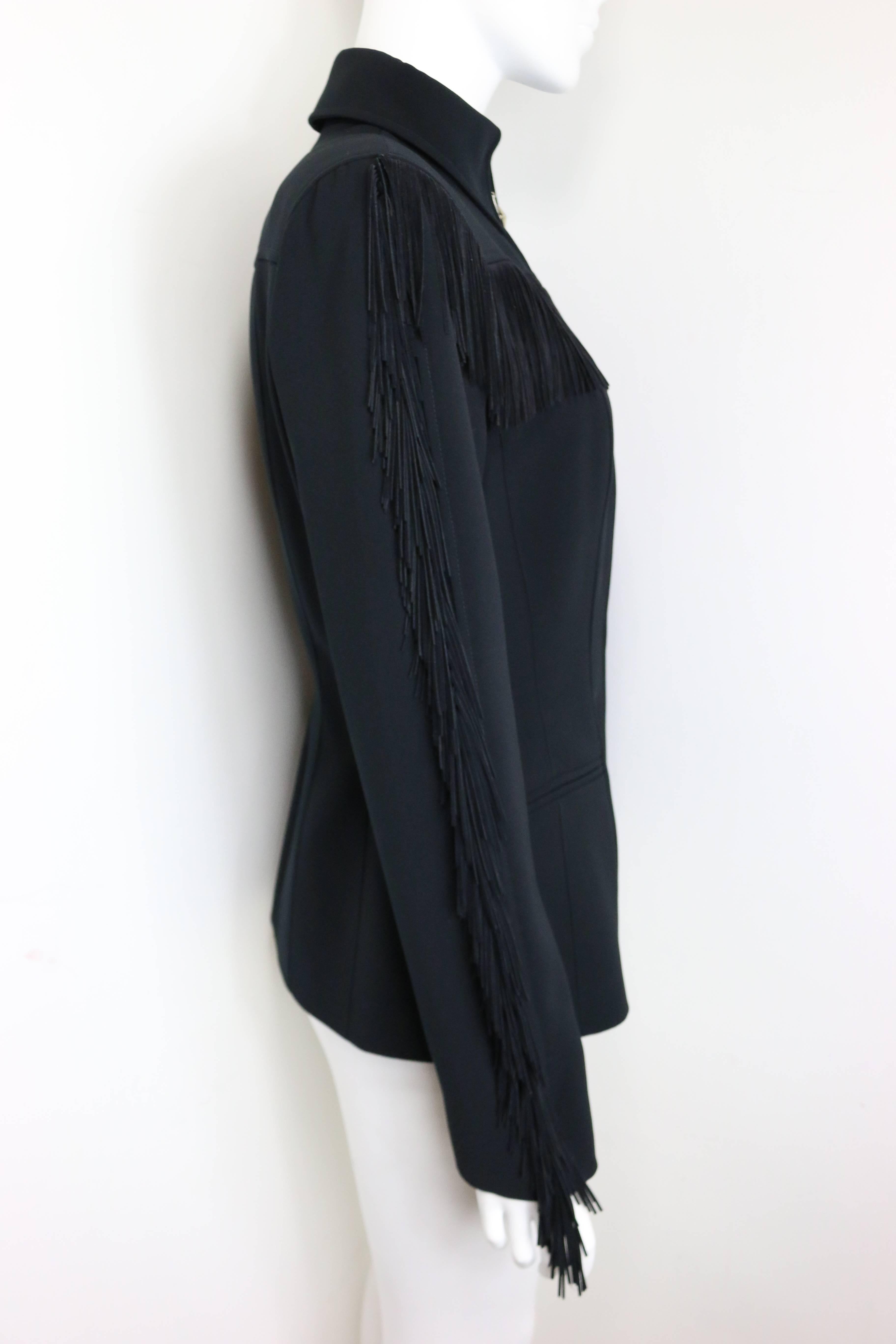 - Vintage 80s Thierry Mugler black structured shoulder fringe jacket. His signature fitted waist and powerful shoulder had millions of followers!!!

- Featuring a silver star button zipper closing, black suede fringe from bust to sleeves. Western