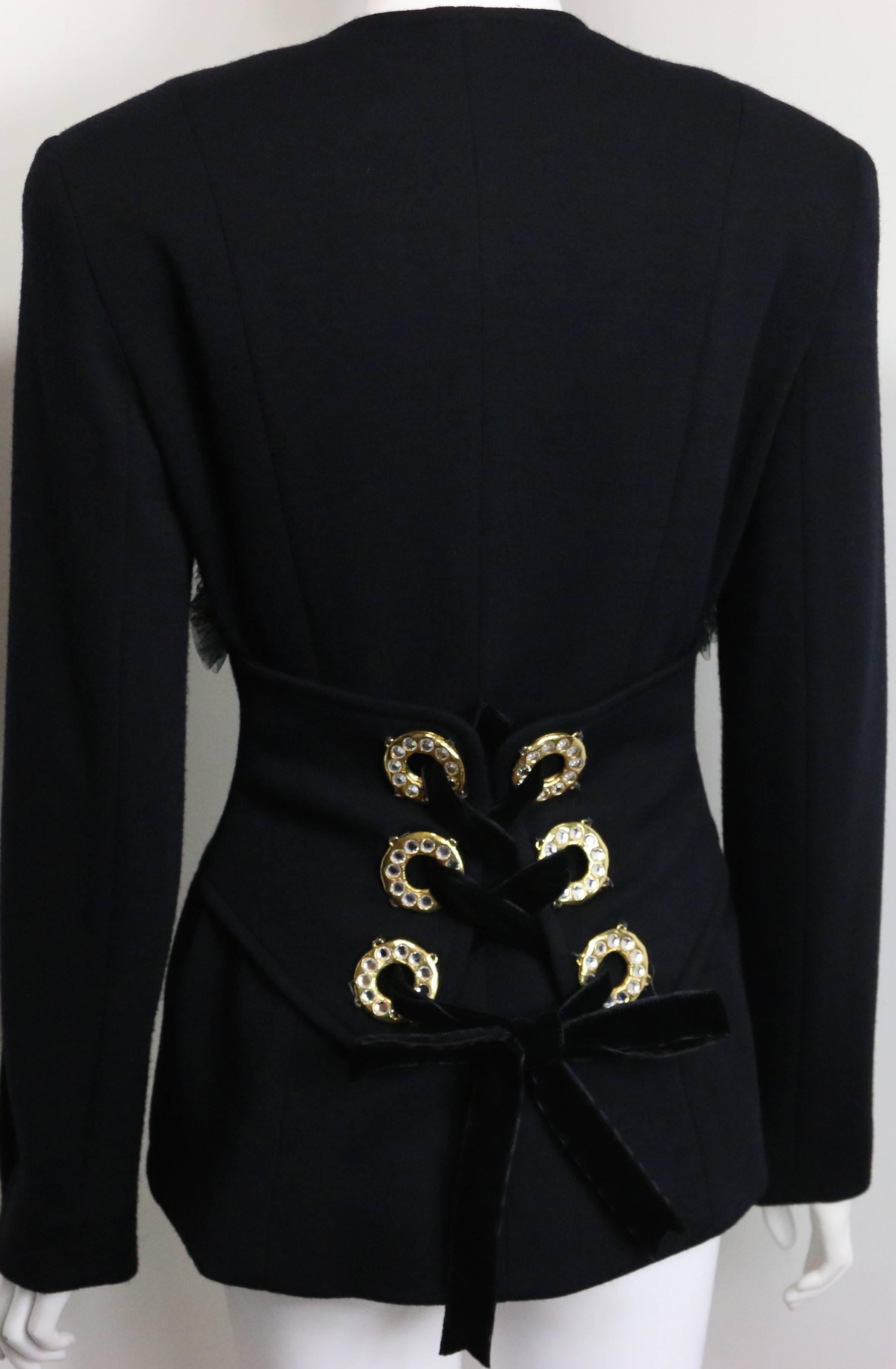 - Vintage 90s Gemma Kahng black wool shawl jacket. 

- Featuring five signatures front black gold toned flowers with rhinestones buttons fastening. Four gold buttons on each cuff. Front Ruffles Details. A statement details at the back with six