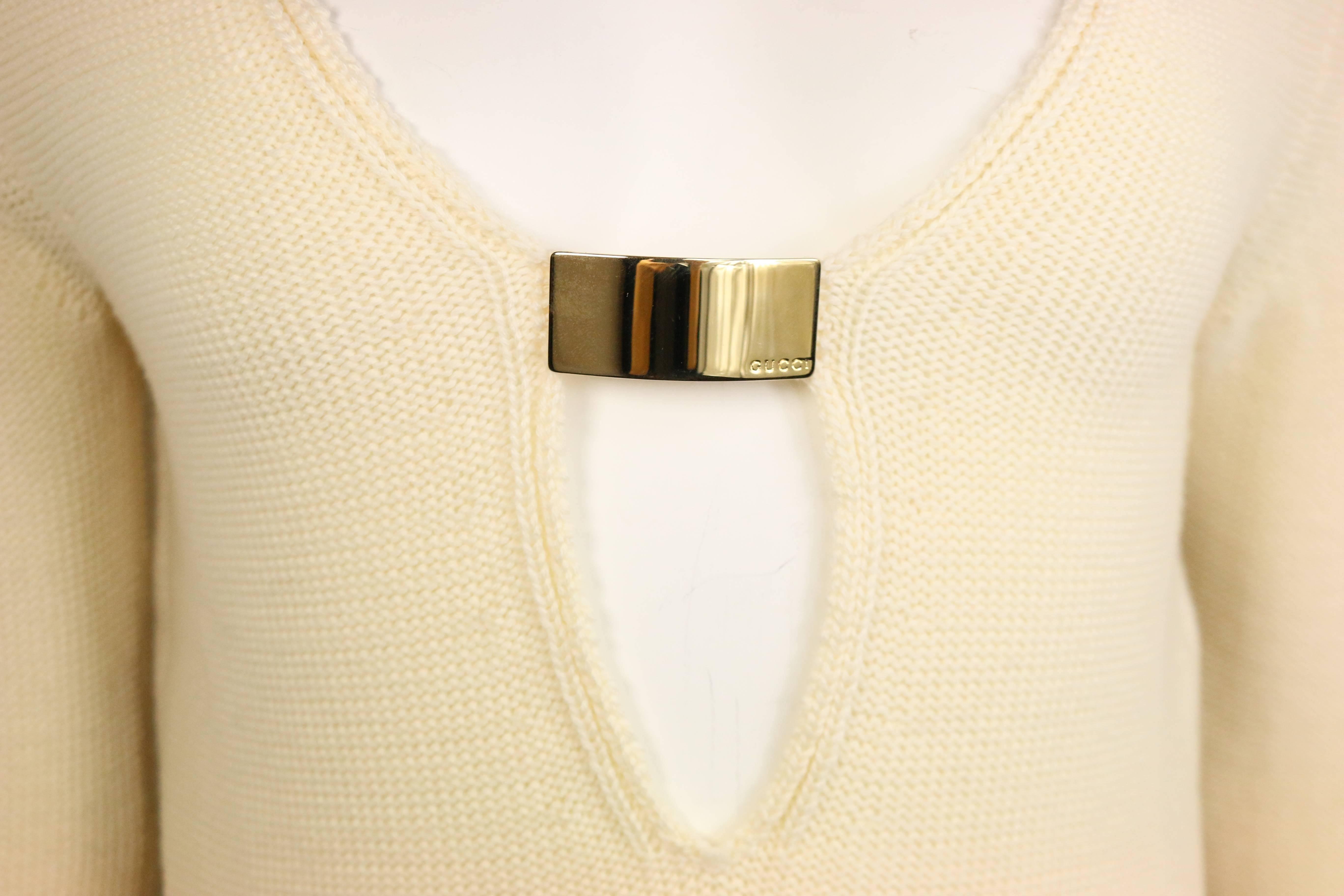 - Vintage Gucci by Tom Ford iconic white wool deep V-neck tunic from Fall 1996 collection. Featuring a signature gold 
