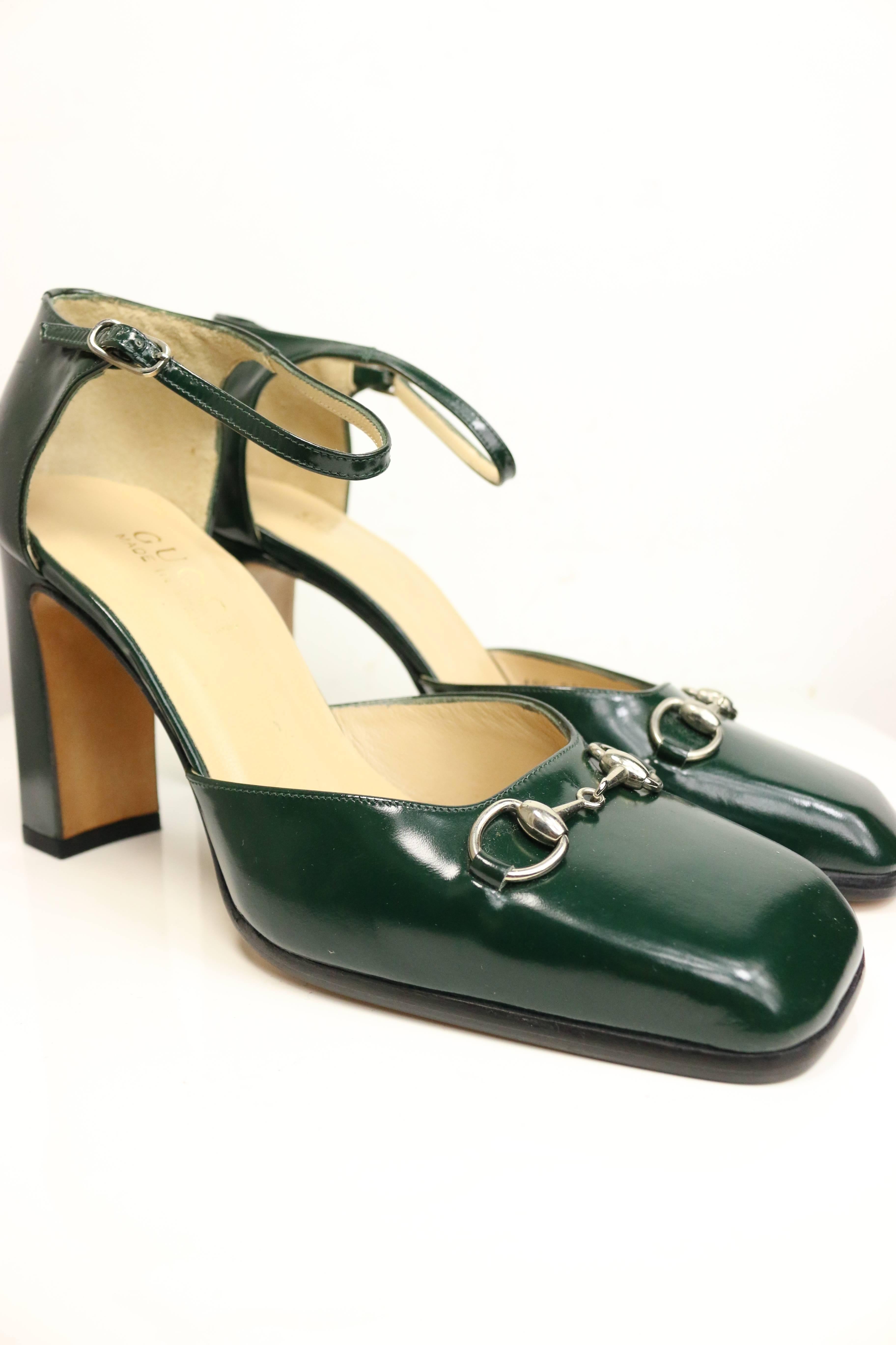 - Gucci by Tom Ford classic green leather square toe pumps with strap. 

- Featuring Gucci classic and signature silver toned hardware horsebit. 

- Rectangle high heels. 

- Made in Italy. 

- Size 37.5. 
