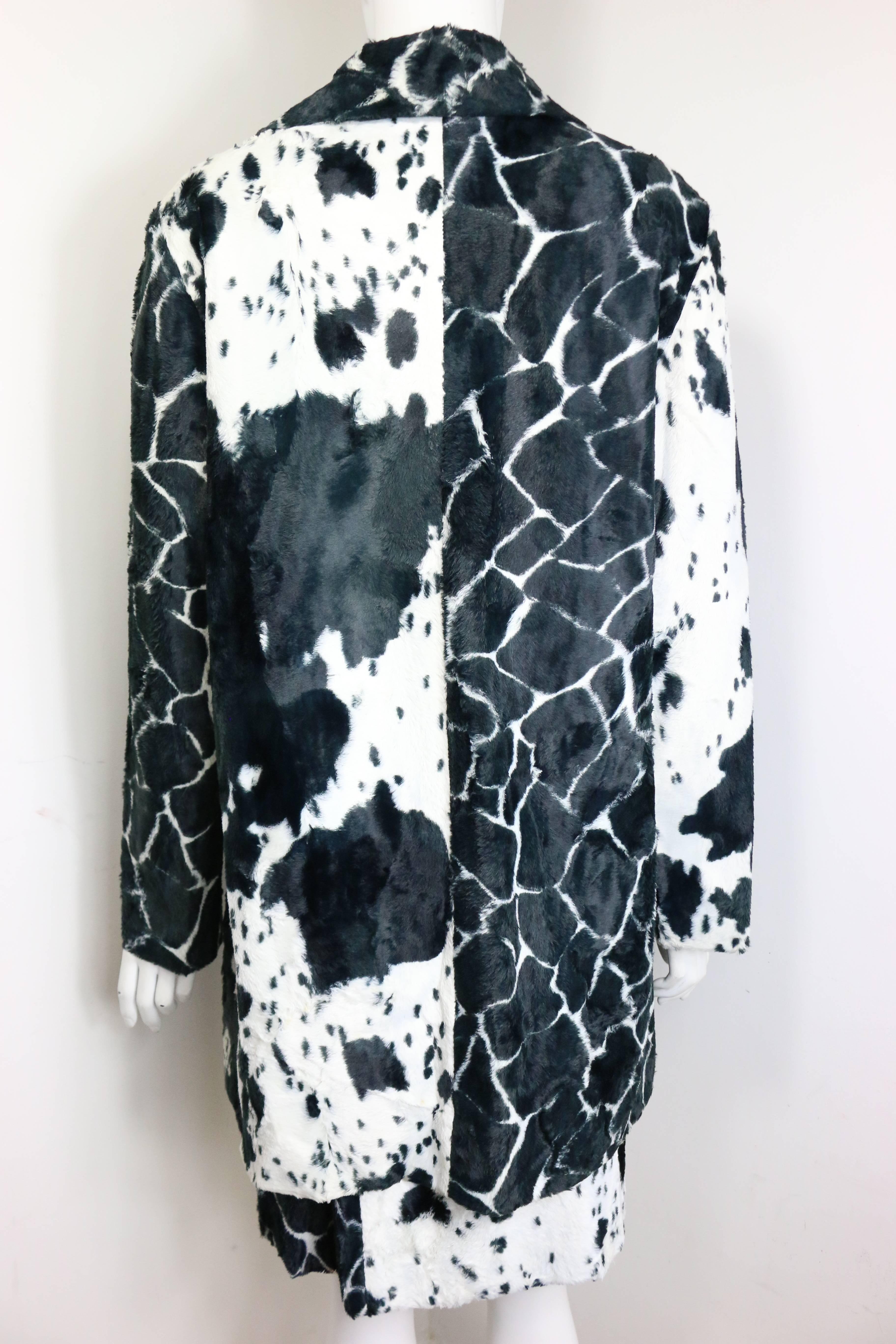 - Vintage 90s Kenzo black and white cow print faux fur jacket and skirt ensemble. Featuring four buttons fastening and two pockets. Animal print will never go out of style! 

- Made in France. 

- Size 38. 

- 67% Cotton, 33% Rayon. Lining: