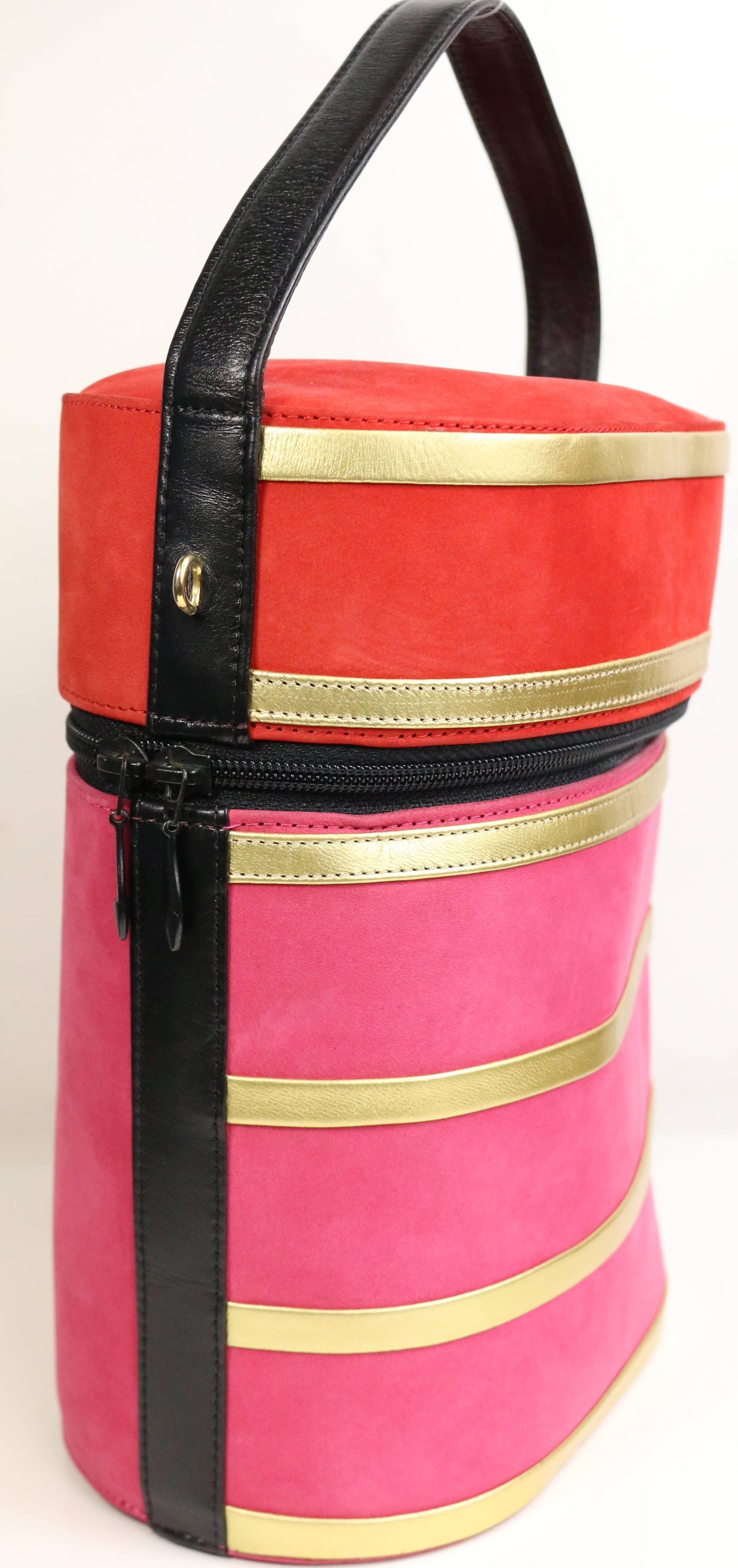 - Vintage 80s Charles Jourdan red and pink suede gold leather stripes round shaped handbag with detachable black leather strap. Lovely bold colours suede is one of a kind!!!

- Made in France. 

- Length: 6 inches. Height: 8 inches. Strap