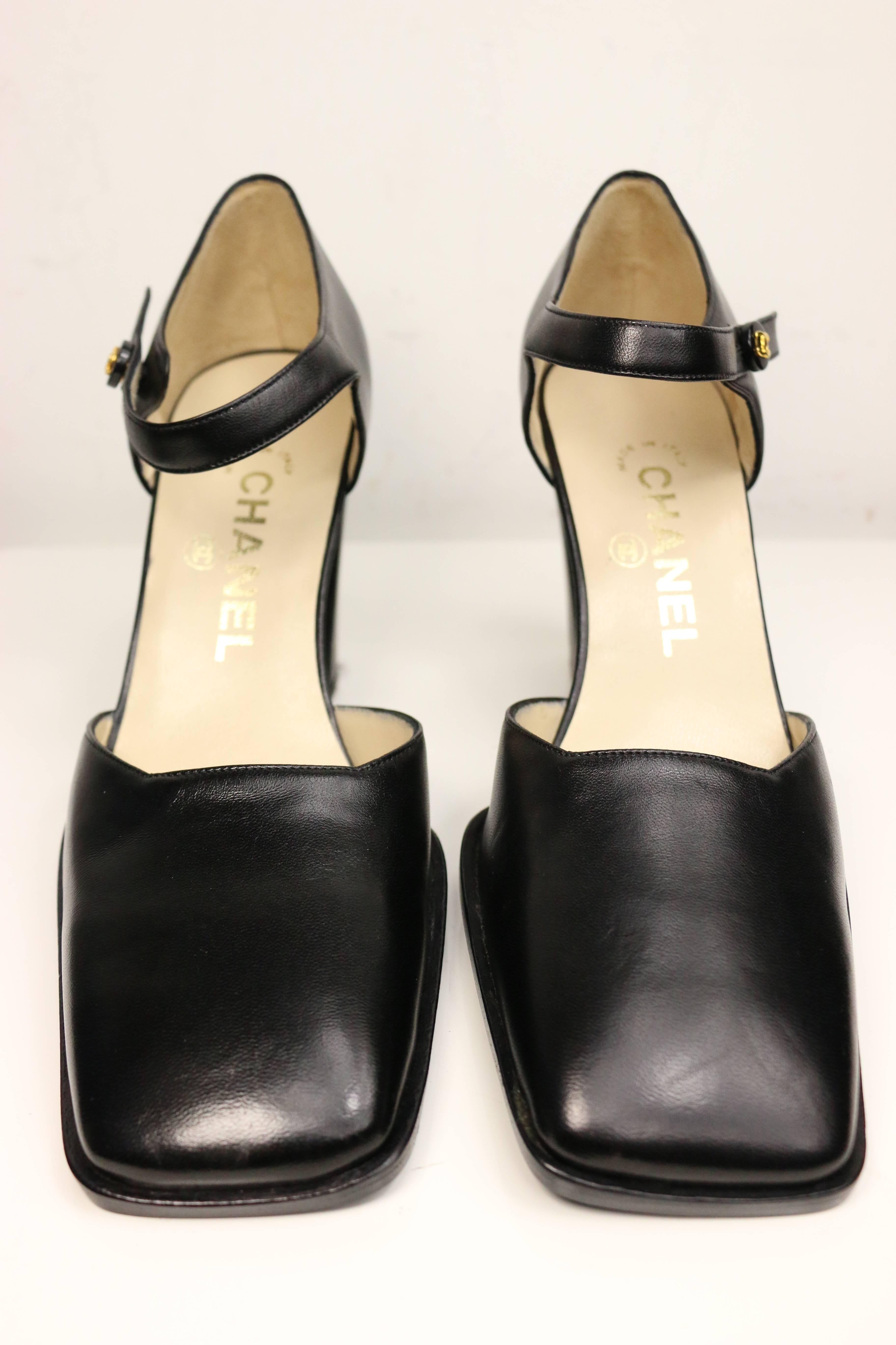 - Vintage 90s Chanel classic black leather square toe heels. Featuring gold 