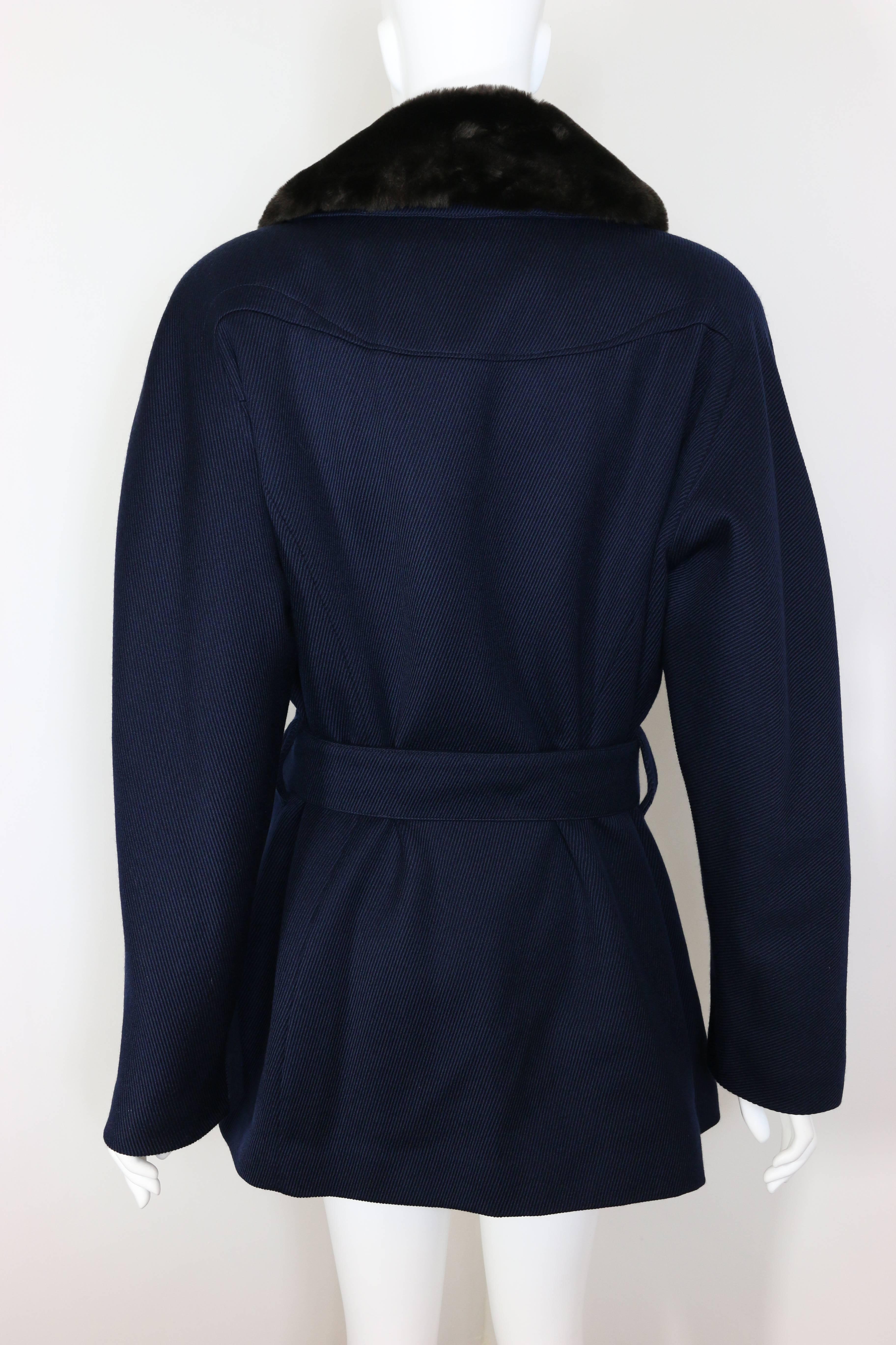 - Vintage 90s Thierry Mugler Navy Blue Faux Fur Detachable Collar Double Breasted Belted Coat. Never been worn with original tag! 

- Round shoulders.  

- Featuring ten silver buttons. 

- Silver belt buckle.  

- Four front pockets.  

-