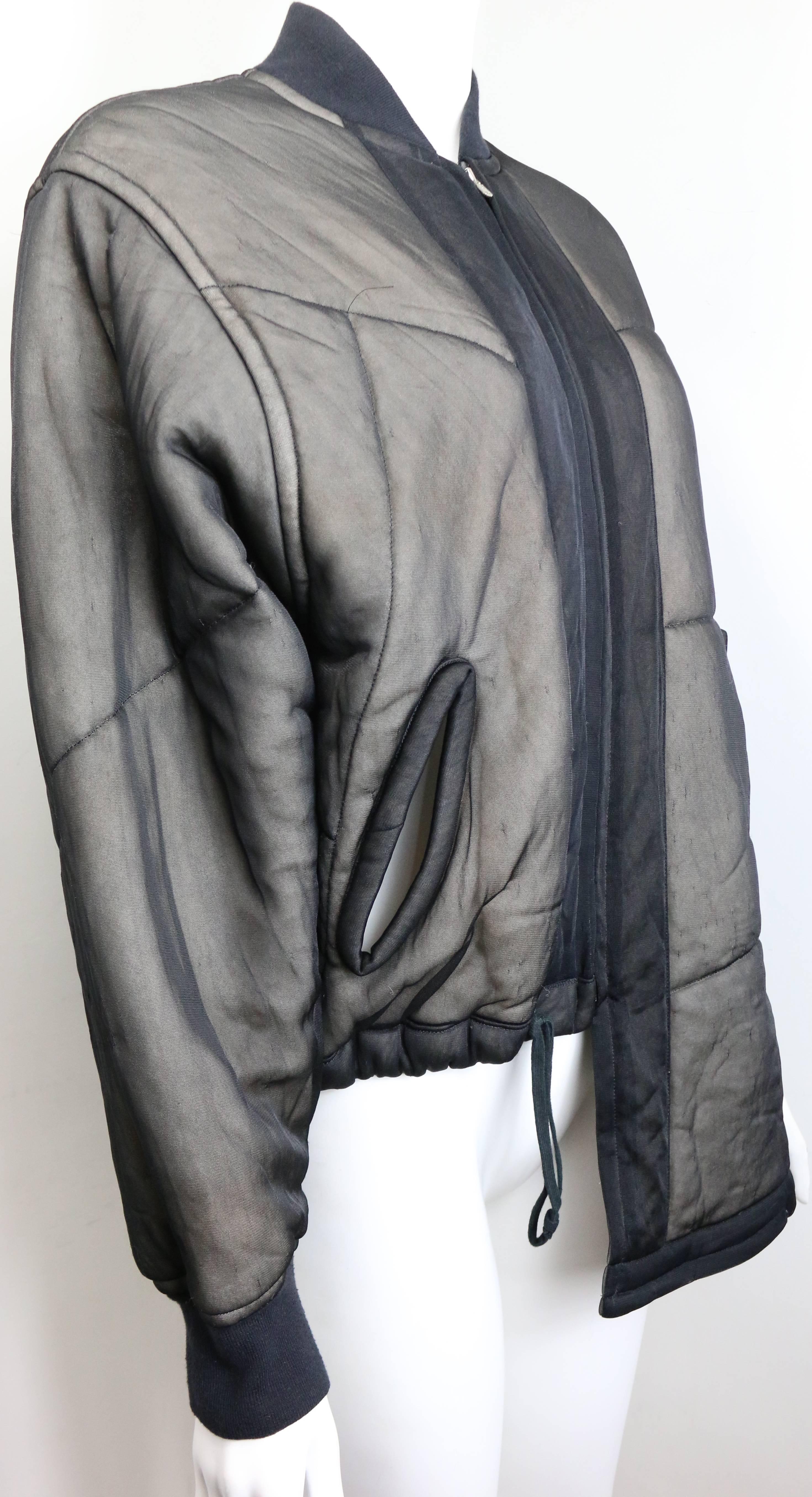 - Vintage 90s Comme des Garcons charcoal grey asymmetric deconstruct bomber jacket.  This piece is complex, and thus provides enormous versitility. Closure with zip to front. 

- Made in Japan. 

- Size S

- 100% Nylon. 

