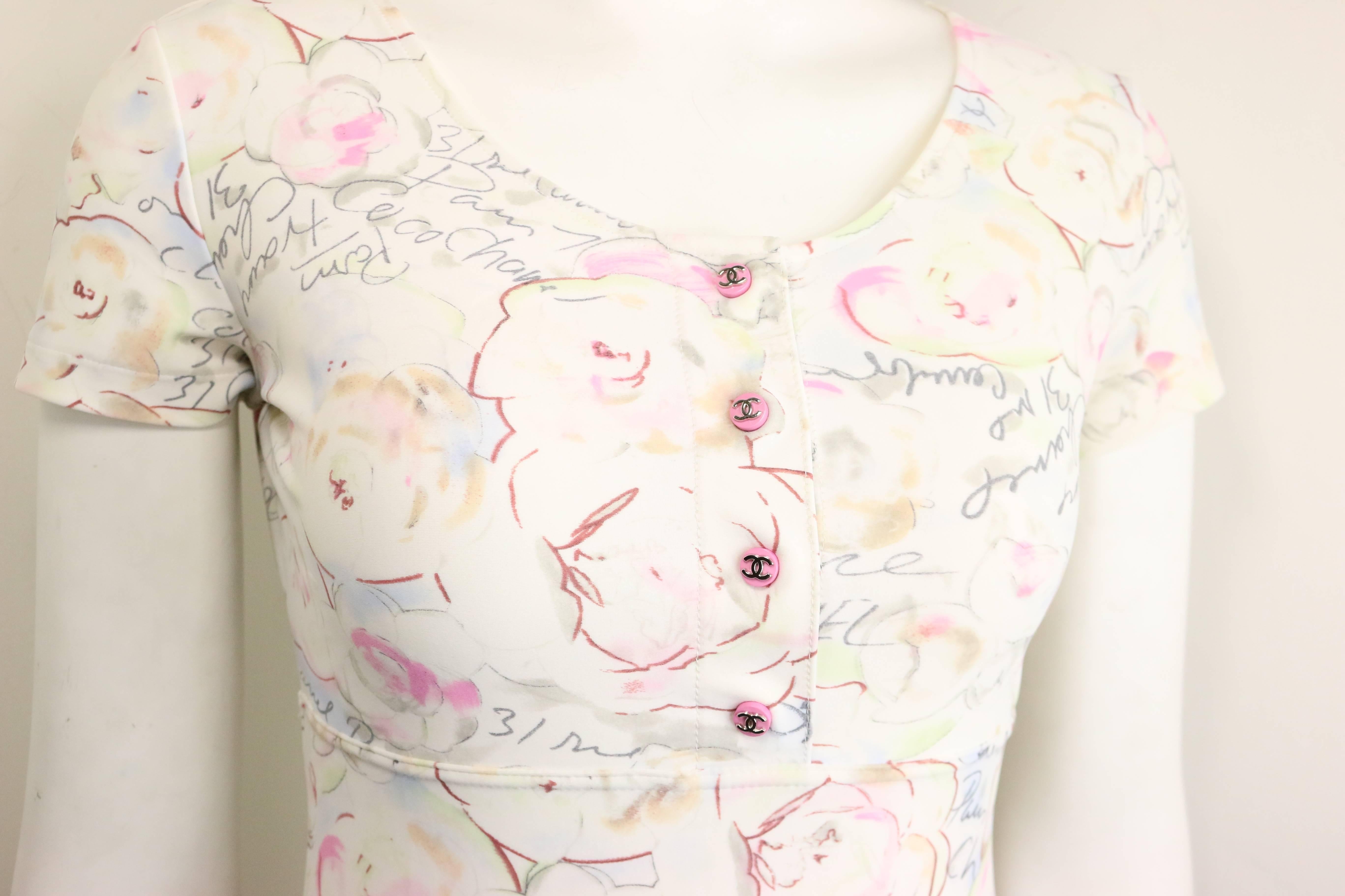 - Vintage Chanel white lycra floral and Coco Chanel print short sleeves dress from 1995 cruise collection. The whole dress have wordings like Paris, France, Coco Chanel written all over! 

- Featuring four pink silver 