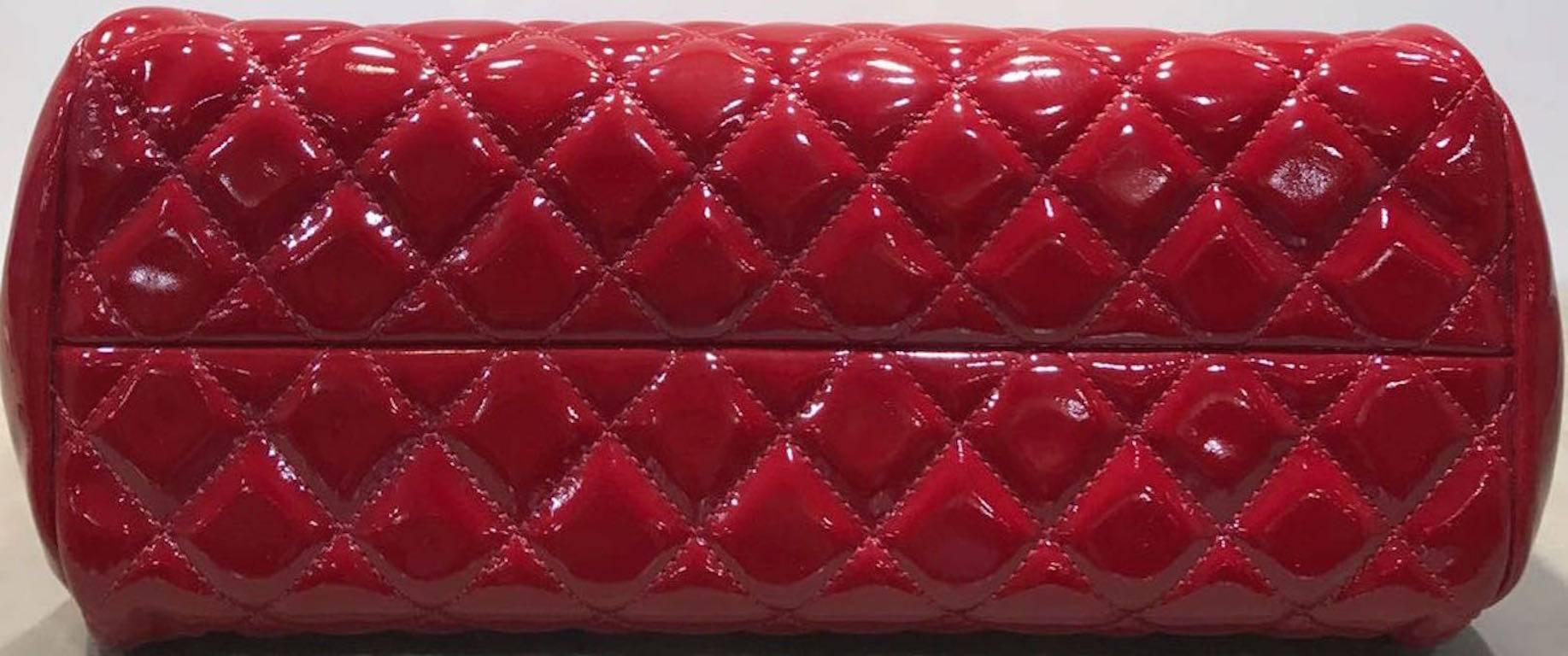 - Chanel red quilted patent leather Mademoiselle bowling bag from year of 2011. This bag is one of the popular since. Featuring signature diamond stitch pattern with interlocking silver toned "CC" logo charm. The middle compartment has a