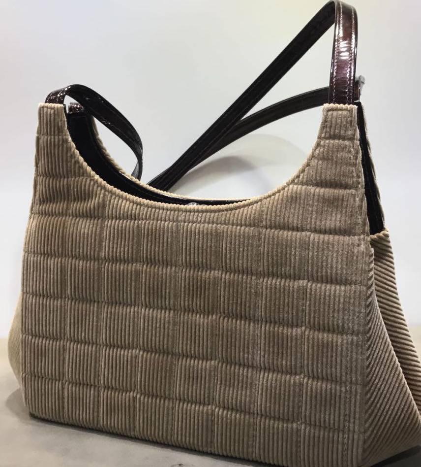 - Chanel Beige Corduroy Brown Patent Leather Shoulder Bag. 

- Featuring two outside open pockets and one inside open pocket. 

- Made in France. 

- Measurement: W 8.6 inches x H 5.5 inches x D 3.5 inches. 

- Handle drop : 12.9 inches. 

- It