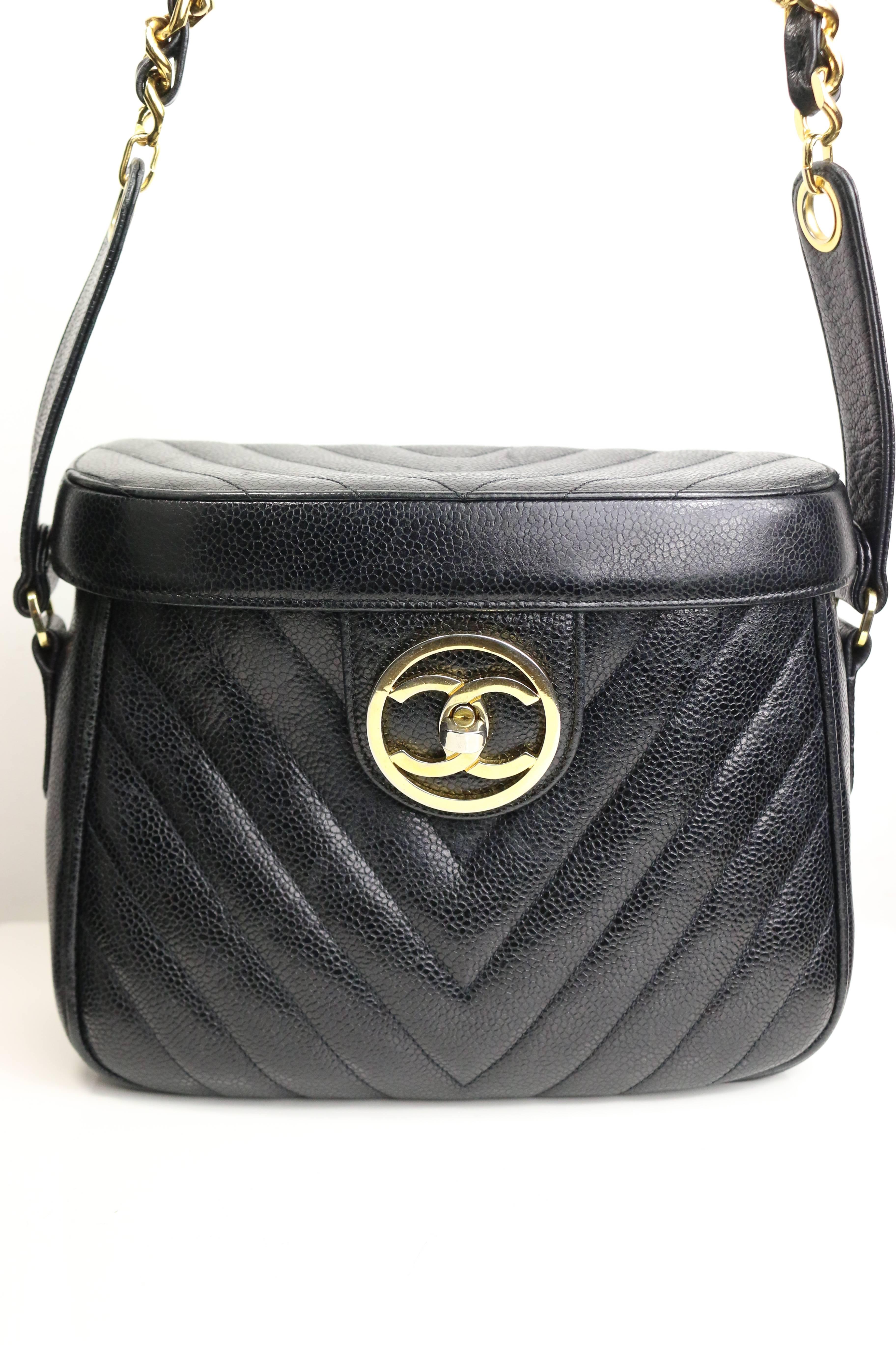 - Vintage 90s Chanel black chevron vanity bag made in caviar leather with gold chain shoulder strap. Featuring a gold "CC" turn lock closure, an interior mirror and zipper pockets. This vintage looking vanity bag goes well with anything.