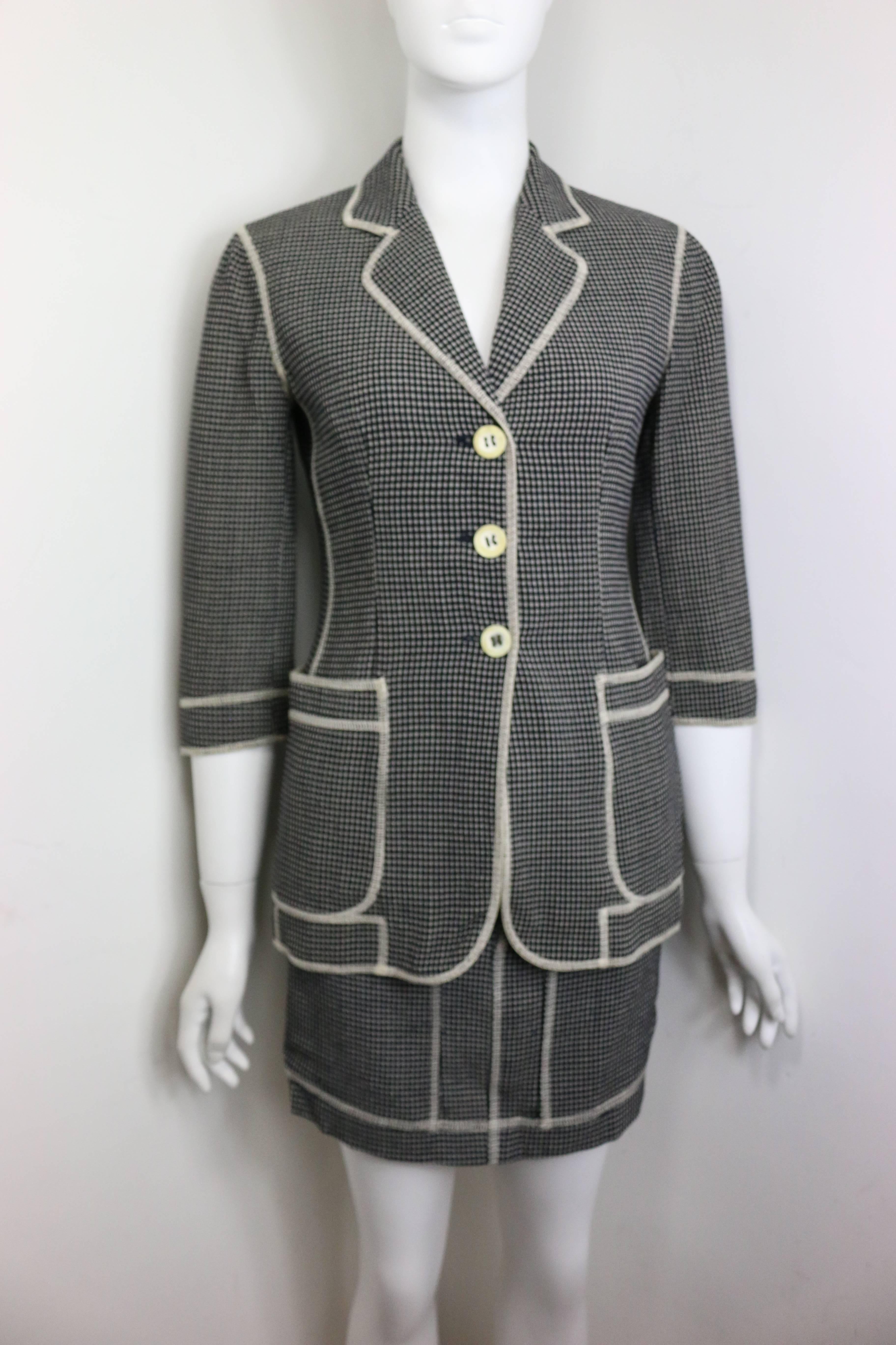 - Vintage 90s Moschino Couture in black and white check pattern with white stitches piping jacket and skirt ensemble. The jacket is three quarter sleeves. The word 