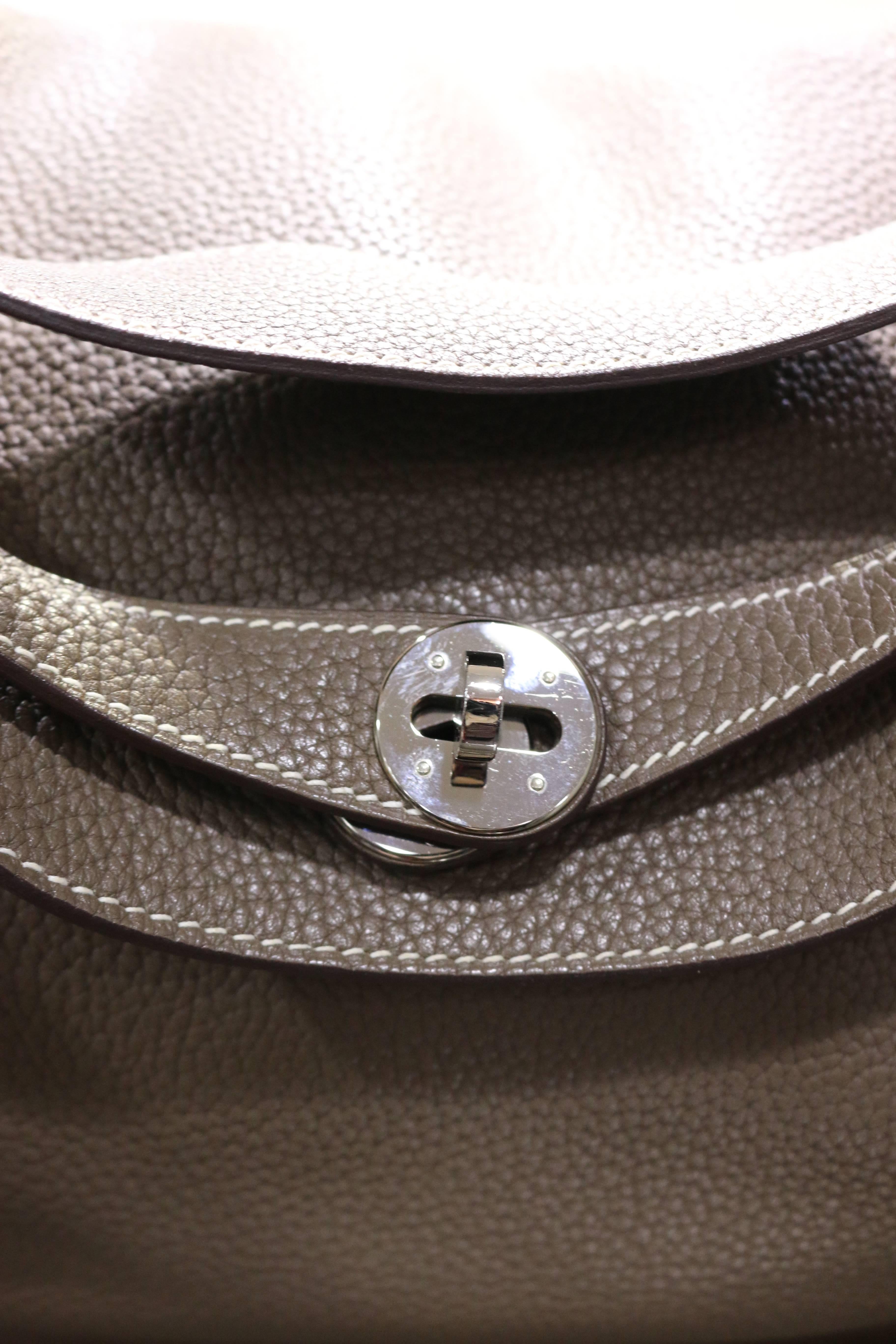 - This super elegant and chic Hermes Lindy 34cm in stoup colour is crafted of fine Taurillon Clemence leather. Featuring an unique looping shoulder strap and a frontal flap with a strap and palladium silver turn lock mechanism. Super spacious