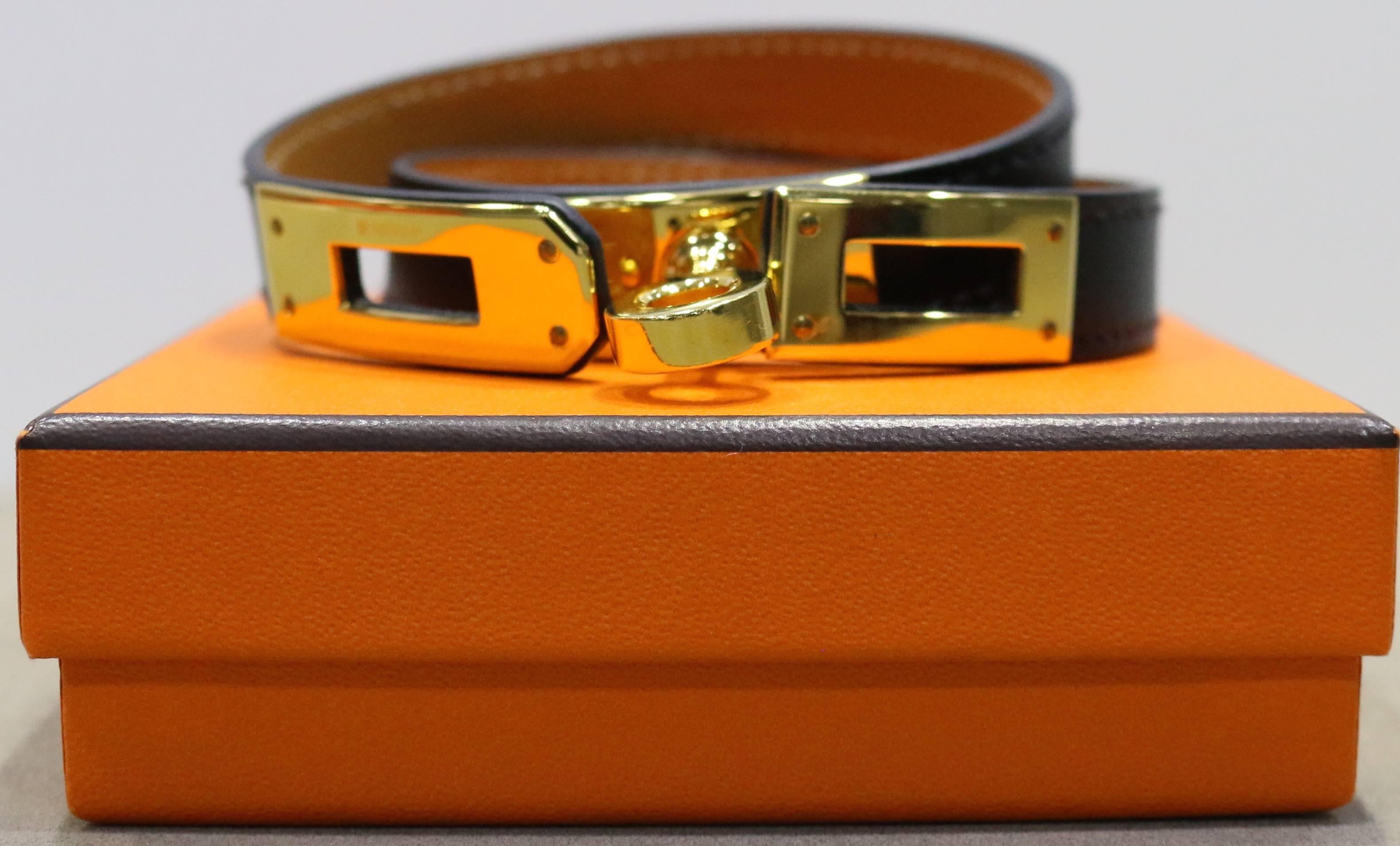 - Authentic and brand new  Hermes black Kelly double tour leather bracelet in gold toned hardware. It is a classic leather bracelet with a sense of chicness! 

- Made in France. 

- Measurement: 37.5 cm 

- It comes with dust bag and original box. 

