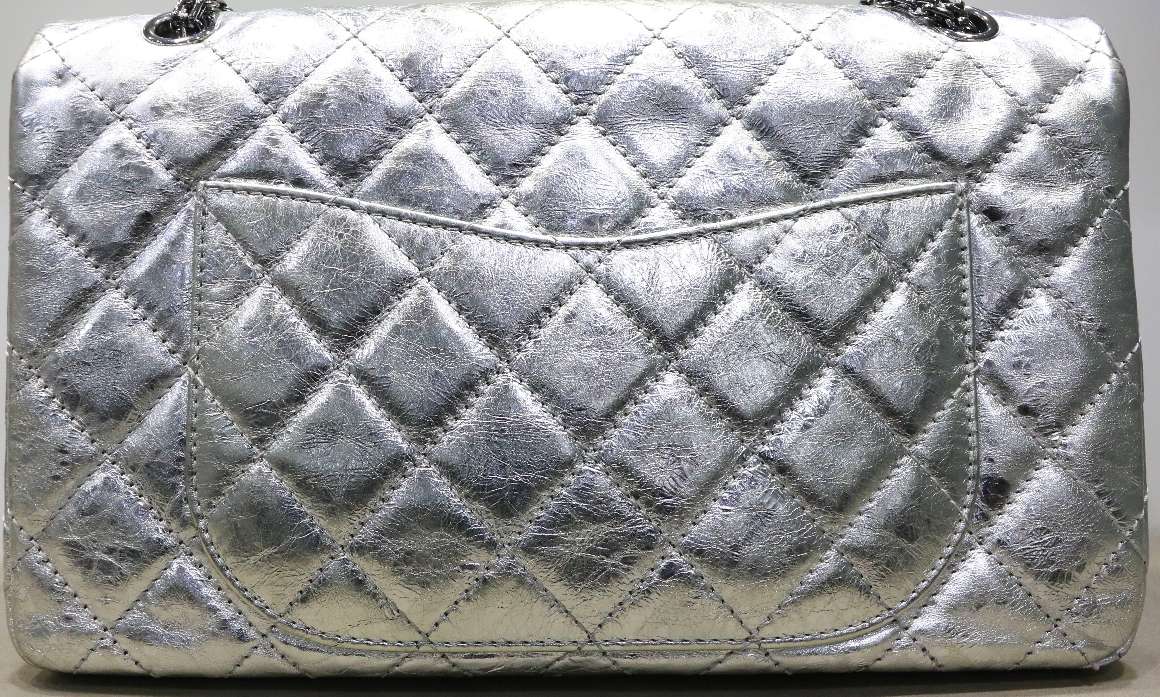 - This Chanel silver metallic reissue 2.55  quilted calfskin shoulder double flap bag is timeless and classic to add to your own collection. Featuring reissue chain link strap, signature diamond quilting, exterior back slip pocket. Its mademoiselle
