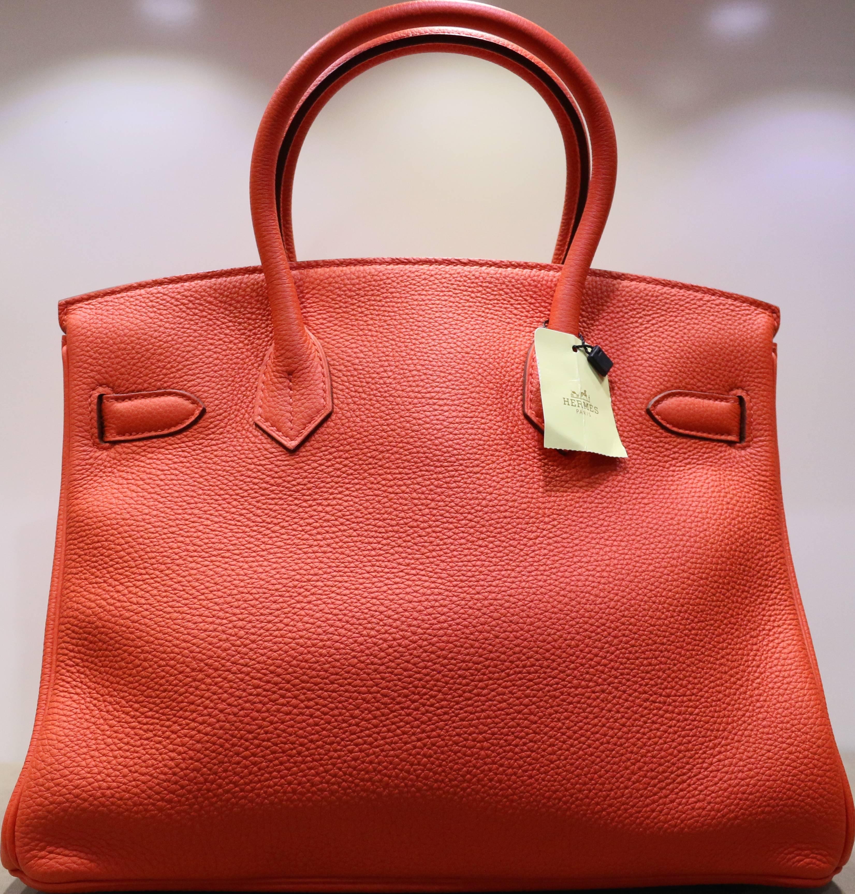 - This pristine, hard to get and never been used Hermes Birkin bag in red togo, 30cm includes padlock, keys, clotted, dust bag and box. Featuring in silver hardware accents. 

- Made in France. 

- Measurement: 23cmH x 30cmW x 17cmD. 
