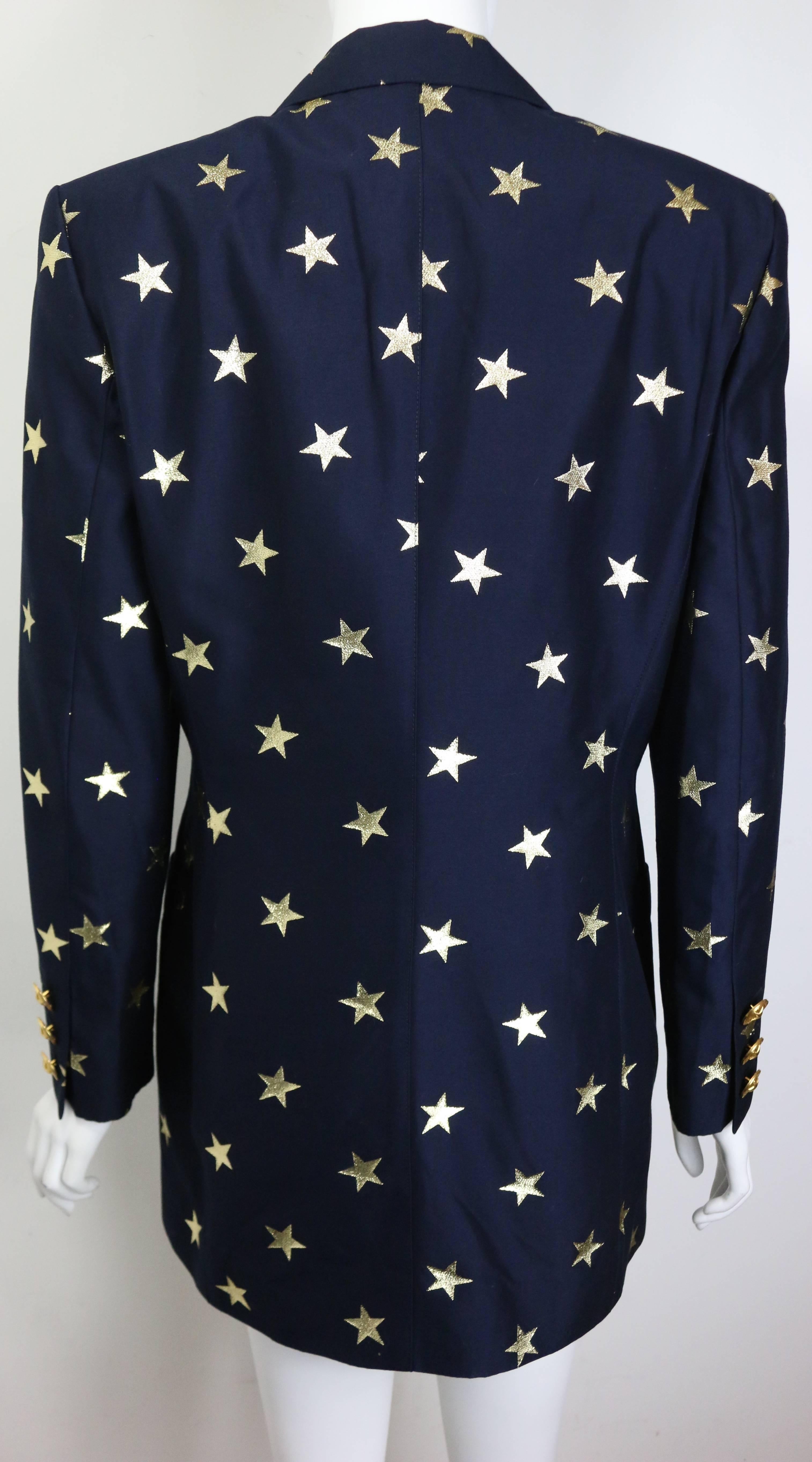 - Vintage 80s Escada navy with gold stars pattern double breasted blazer. This one of a kind blazer represent the glamours , big silhouette and the golden era of the stylish 80s!!!

- Featuring six front gold toned 