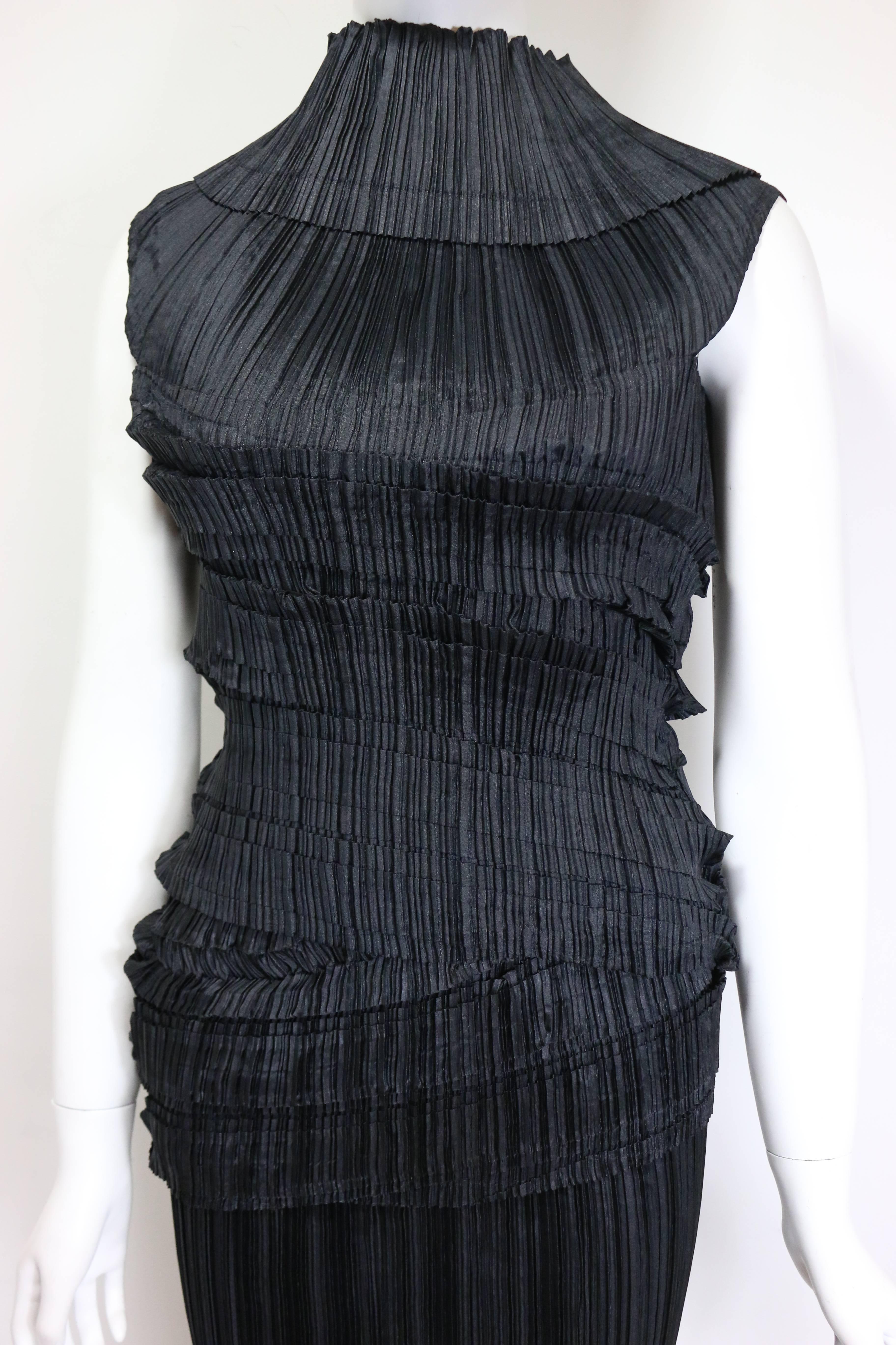 - Vintage 90s Issey Miyake black pleated sleeveless high neck top and long skirt ensemble. Such a signature and iconic pieces of artwork of Issey Miyake! Its brand new that still have original tag attached to it.

- Made In Japan. 

- Size M. 

-