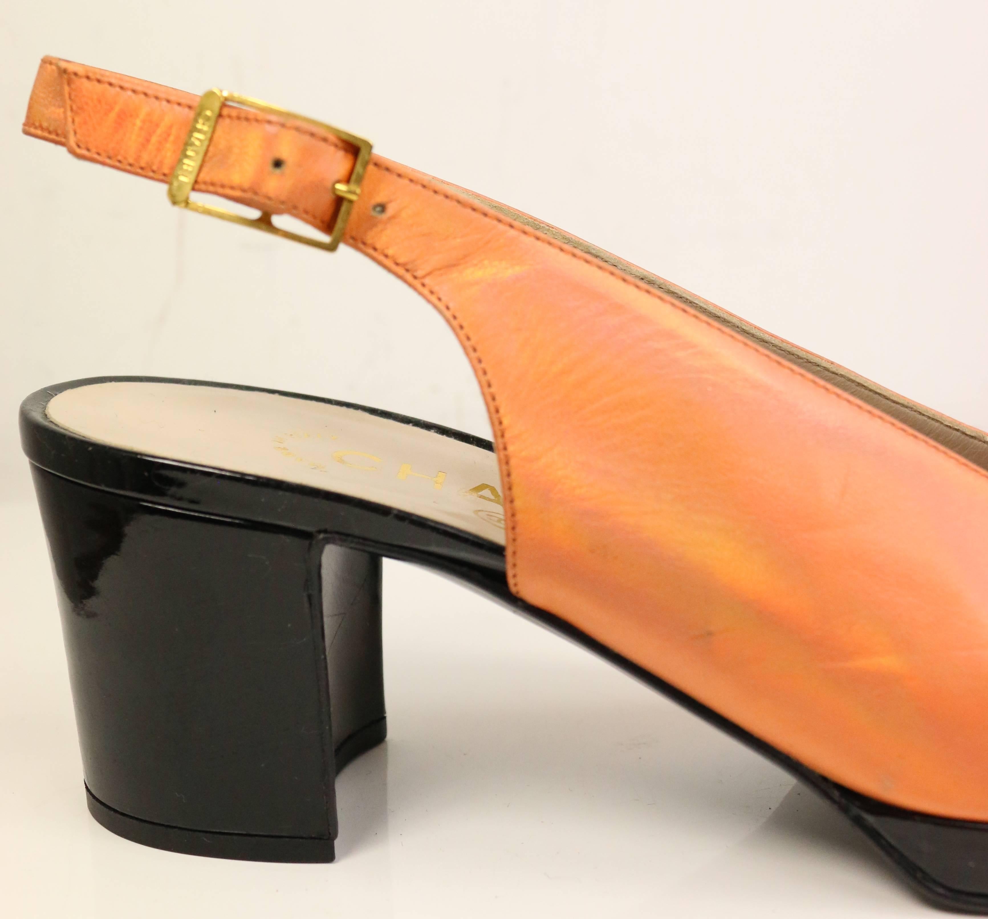 - Vintage 90s Chanel bi tone metallic orange with black patent leather square toe Mary Jane slingback shoes. This is a classic Coco Chanel style, elegant and chic summer shoes. 

- Size 37.5. 

- Made in Italy.

- Comes with dust bag. 

- Condition: